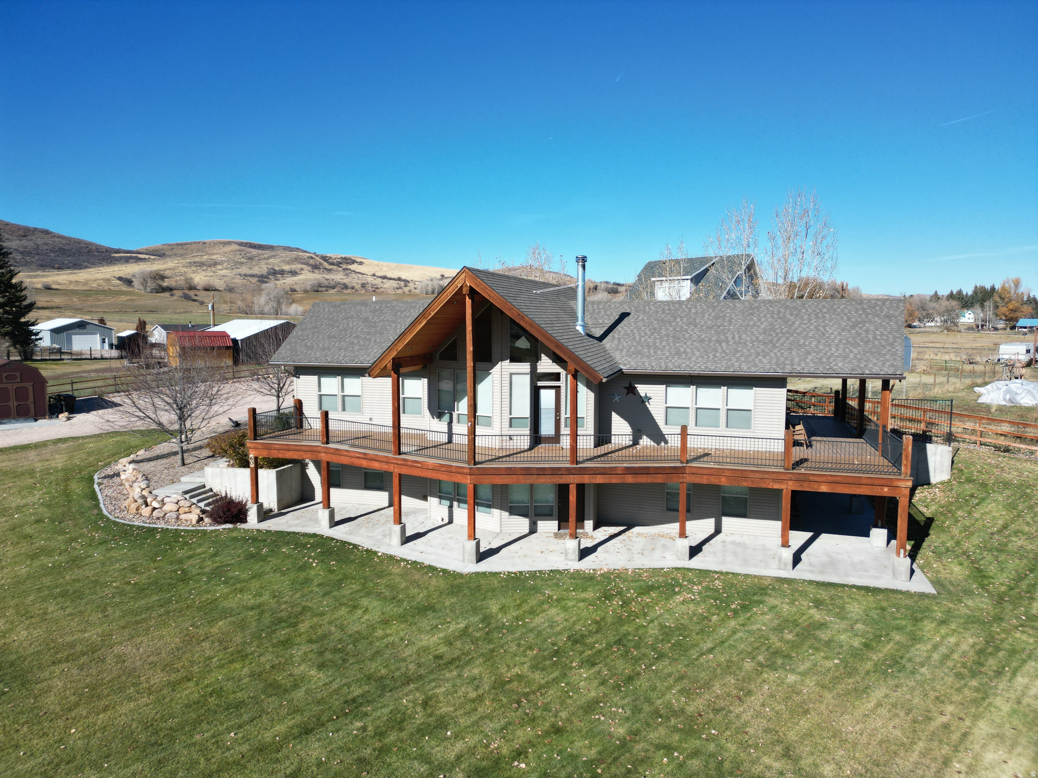 Price reduced No HOA, bring the family & all your friends to Rawhide Rendezvous-your spacious Bear Lake retreat offering quiet solitude, year-round access.  Located in the peaceful town of St. Charles, Idaho, this one-owner, two-story, wheelchair-accessible home sits on a .87-acre lot and provides the ideal setting for family living, vacation use, or continued short-term rental potential. Well cared for and filled with cozy Bear Lake ambiance, this property has been enjoyed by the sellers for both family gatherings and rental stays.  With approx. 3,400 sq ft, the home includes 6 bedrooms and 4 full bathrooms, plus generous gathering spaces on both levels. The main floor features comfortable living areas, a woodburning stove for winter warmth, and air conditioning for summer comfort. An oversized two-car garage and abundant exterior parking offer plenty of space for vehicles, trailers, and recreational toys.  Located just 10 minutes from North Beach and within easy reach of Garden City, Minnetonka Cave, North beach and year-round outdoor recreation-including boating, hiking, snowmobiling, and ATV trails-this home delivers the space, privacy, and lifestyle that make the Bear Lake Valley truly special.