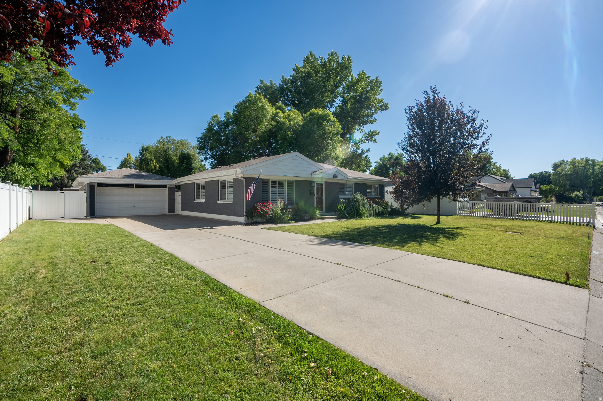 Beautifully updated Murray rambler situated on a spacious lot in a quiet, established neighborhood! This move-in-ready home features an updated kitchen with shaker cabinetry, modern countertops, stainless steel appliances, and an open, inviting layout perfect for everyday living and entertaining. Enjoy abundant natural light, updated finishes, and pride of ownership throughout. Outside, you'll find a detached 2-car garage, oversized driveway with ample parking, mature trees, lush landscaping, and a fully fenced backyard offering privacy and room to relax. Conveniently located near parks, schools, shopping, dining, and freeway access. Don't miss this incredible opportunity to own a beautifully maintained home in the heart of Murray! Information provided as a courtesy only. Buyer and buyer's agent are advised to verify all information.