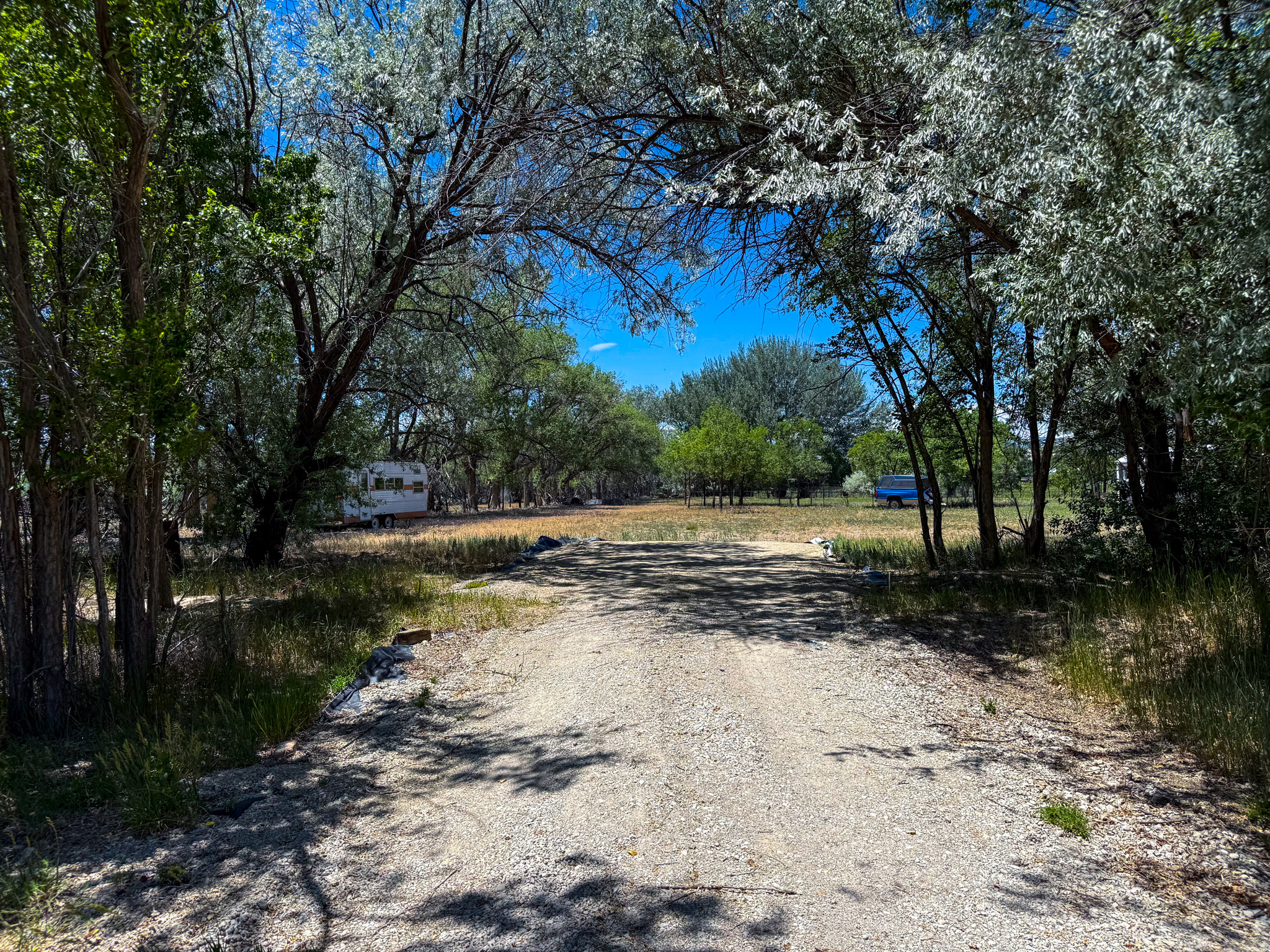 Rare opportunity to own a full acre of land with a country feel while still enjoying the convenience of being in town. Although surrounded by the City of Price, this unique property is actually located in the county, offering added flexibility and potential uses. Situated on 450 South (Dees Way), this quiet, tucked-away parcel sits on a dead-end road with no through traffic, providing a peaceful setting for your dream home. The property is fully fenced and surrounded by mature trees that offer shade, privacy, and a natural windbreak. With plenty of room for horses, RVs, equipment, and other recreational toys, the possibilities are endless. This property didn't last long the first time it was offered, so don't miss your chance to make your dream a reality on this exceptional acre of ground. Square footage figures are provided as a courtesy estimate only. Buyer is advised to obtain an independent measurement and verify all information to their satisfaction.