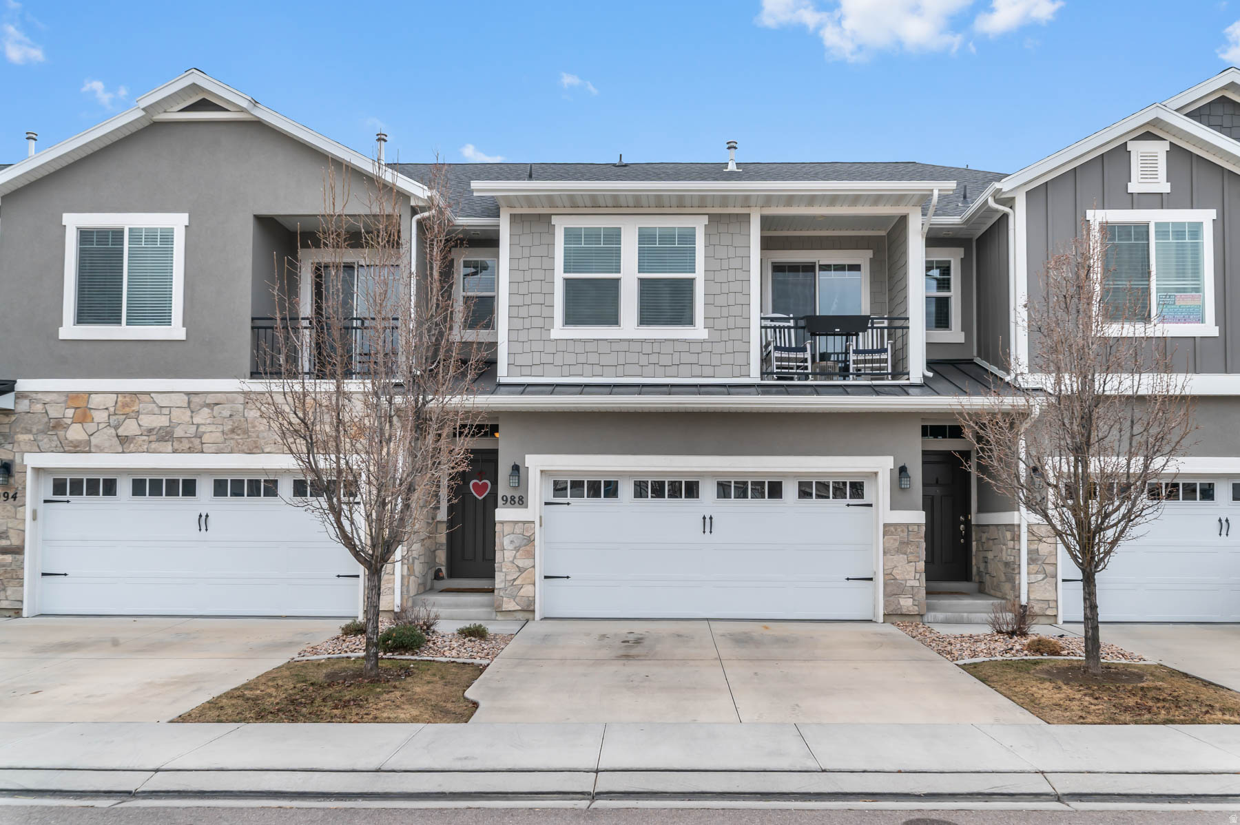 **PRICE IMPROVEMENT! OPEN HOUSE MAY 30TH FROM 3PM-5PM**WELCOME HOME to this stunning newer townhome, thoughtfully designed with comfort and style in mind. Boasting four spacious bedrooms and a FULLY FINISHED basement, this beautifully upgraded property features faux-wood quality tile flooring throughout, sleek stainless steel appliances, and a cozy fireplace that creates the perfect gathering space. The attached garage adds convenience, while the FULLY FENCED & GATED backyard with a private patio-an exceptional find for a townhouse-offers the ideal setting for outdoor entertaining or relaxing evenings. Backing onto a lush grassy common area and located near a community playground, this home is perfect for enjoying both privacy and connection. Unwind on the balcony as you take in breathtaking mountain views-this is low-maintenance living at its finest. You won't want to miss out on this one!