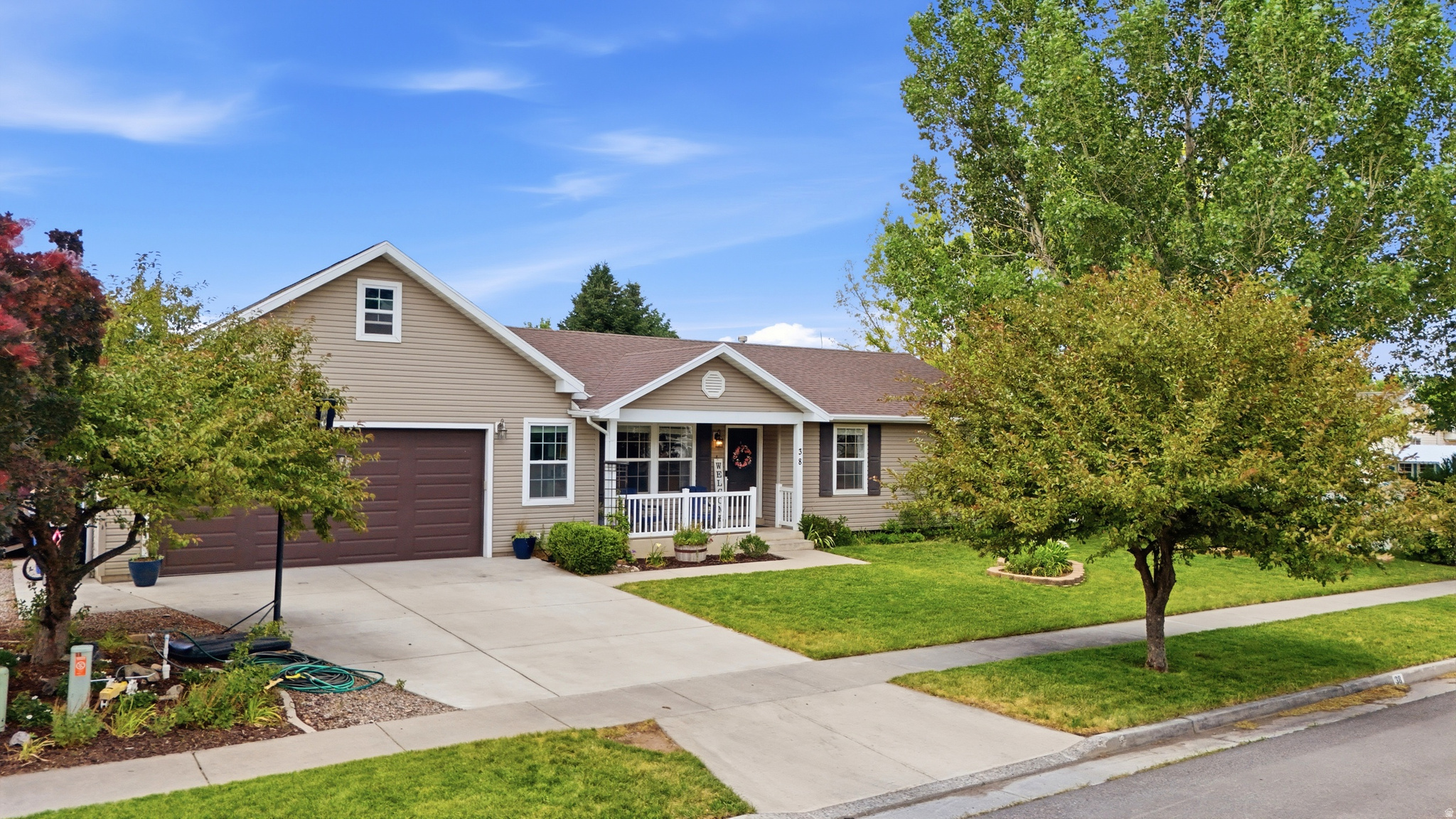 Conveniently located near schools, parks, and local amenities, this home combines comfort, practicality, and small-town charm. With four bedrooms, and a spacious garage, there's room for everyone and everything. This home has an extra large pantry, perfect for cooking adding utility and practicality to the kitchen.  Enjoy the beautifully landscaped yard, complete with mature trees, vegetable garden and flower beds.  Don't miss the opportunity to make this Hyrum home your own!
