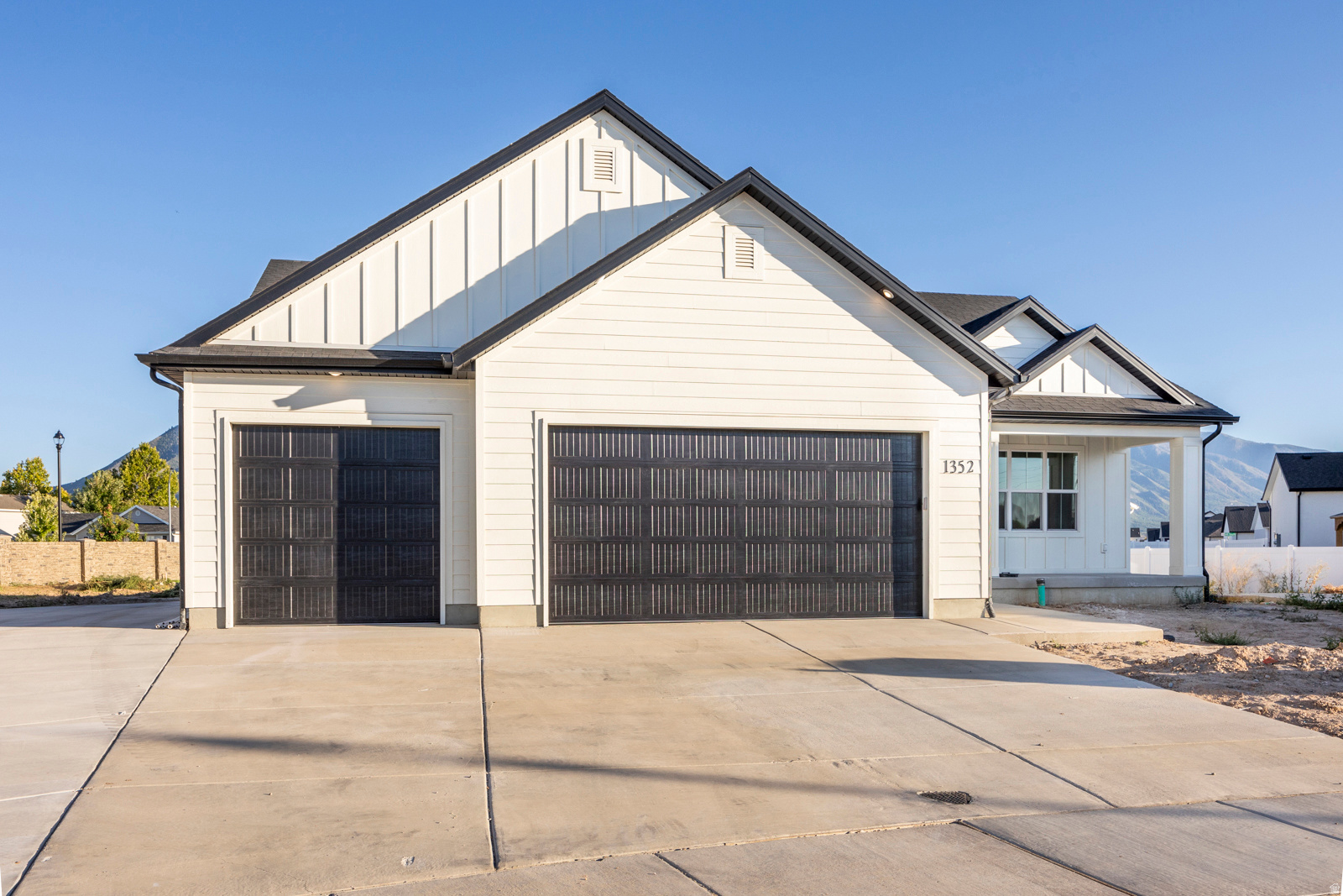 **$12,000 Preferred Lender Incentive** FULLY FINISHED ADU!  You will love this beautiful, thoughtfully designed home! The main floor features vaulted ceilings,  LVP flooring throughout,  quartz countertops, and custom cabinetry. Enjoy a functional layout with three bedrooms, plus a versatile front room that can easily serve as a fourth bedroom, home office, or flex space. The basement offers versatility with a full ADU, separate entrance, and separate thermostat-perfect for rental income or multigenerational living, plus two additional bedrooms and a full bathroom not included in the ADU ideal for extended living or guests. Additional highlights include a third-car garage providing storage or extra parking, and an RV pad. Front yard landscaping will be completed in Spring/Summer. *Photos are taken from another home, same floorplan. Colors/finishes and layout may vary.** Home will be completed in 1-2 months   Square footage figures are provided as a courtesy estimate only.  Buyer is advised to obtain an independent measurement.