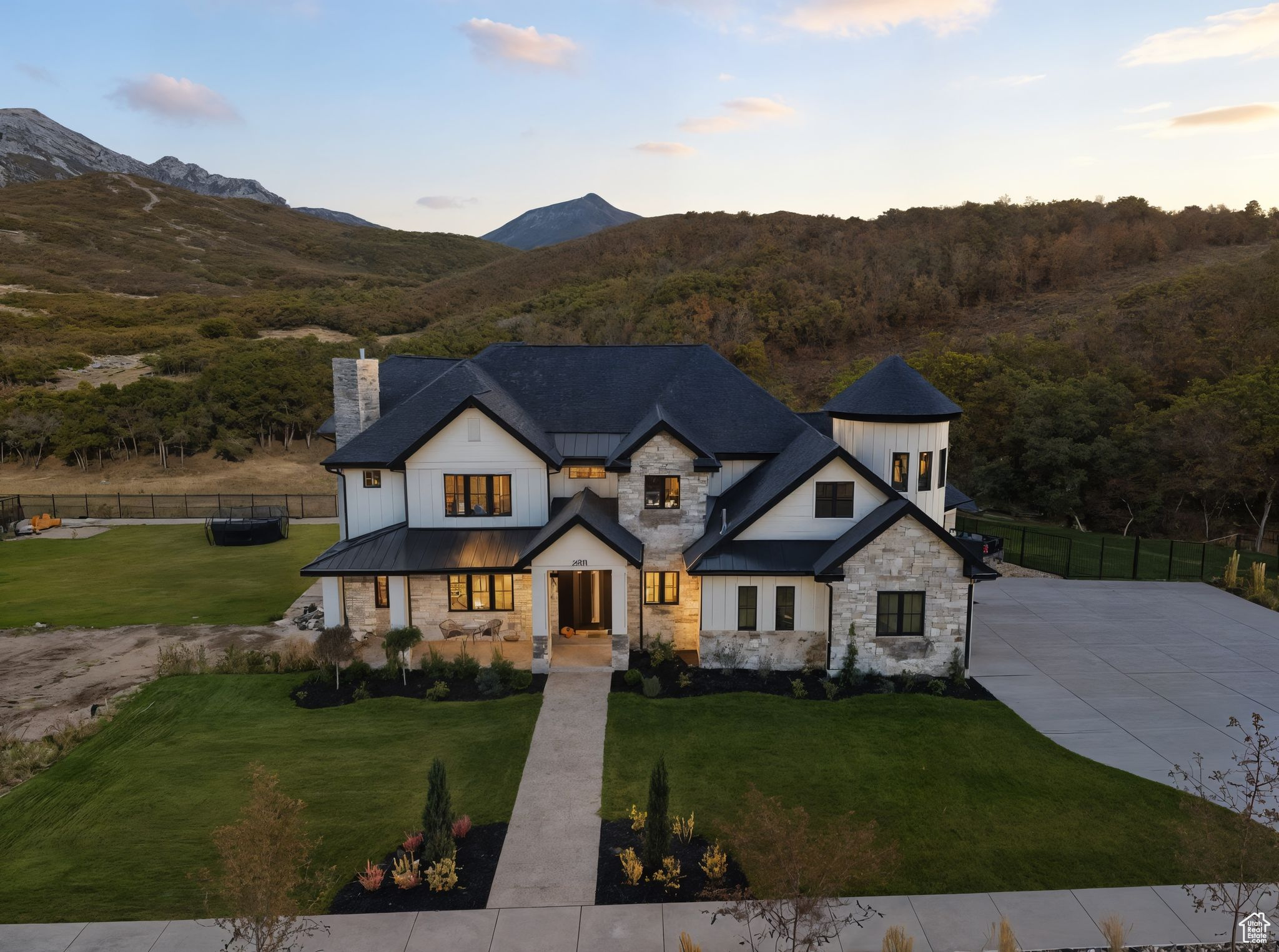Now including Lot 39 (Parcel #45-683-0039) at 0.707 acres and Lot 41 (Parcel #45-683-0041) at 0.367 acres, this property offers nearly 2 acres of exceptional space. This stunning home features 8 bedrooms, 7 bathrooms, and nearly 8,000 sq ft of living space, perfectly situated on this expansive lot. The backyard opens directly to the Corner Canyon trail system, giving you unmatched access to hiking, biking, and nature, all while enjoying breathtaking views of Lone Peak each morning. Inside, you'll find thoughtful details at every turn, a butler's pantry, an upstairs library, and a basement designed for both entertainment and relaxation. Enjoy a full gym (complete with all equipment), a cozy arcade nook, a hidden storage room, and a state-of-the-art theater with all necessary equipment provided. Technology and convenience elevate the experience with whole-home speakers and Control4 smart lighting, allowing you to manage lighting inside and out from your phone. Step outside to your own private oasis, complete with a gorgeous pool and built-in hot tub perfect for relaxing or entertaining year-round. Included with the home are professionally designed blueprints (a $40K value) for a custom indoor sports court, thoughtfully crafted to match the home's architecture and elevate its lifestyle appeal. More than just a home, this is a one-of-a-kind retreat where comfort, luxury, and recreation come together in an exceptional offering.