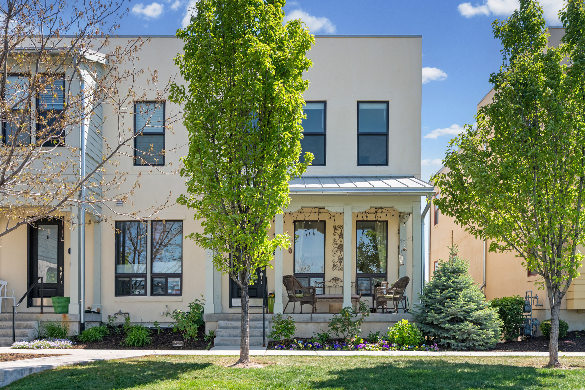 Welcome to this exceptional end-unit townhouse in the beloved Daybreak community  tucked back from South Jordan Parkway for a quiet, secluded feel, yet just minutes on foot from Harmons, the ballpark, Oquirrh Lake, and a variety of restaurants. Don't let the address fool you: this home enjoys a private, peaceful setting while keeping everything you need within easy reach. Beautifully maintained by its original owner, every thoughtfully curated detail shows. The main floor is designed for living and entertaining, with open gathering areas that flow seamlessly into the kitchen, featuring quartz countertops and a pantry. Step out onto the private deck to enjoy stunning mountain views while you grill, making every meal an experience. The massive primary suite is a true retreat, bathed in natural light thanks to the coveted end-unit position, with 9' ceilings, an oversized soaking tub, and a dedicated makeup vanity. The fully finished basement offers an additional bedroom and full bath ideal for guests seeking their own private space. Out front, a charming porch and enhanced landscaping invite you to relax and visit neighbors. HOA dues include Quantum Fiber Optic internet, resort-style pools, lake access, free use of paddleboards, kayaks, and canoes, miles of scenic trails, parks, dog parks, playgrounds, a fully equipped gym, a community center, and live summer concerts. A home this well-maintained, in a location this exceptional, is a rare find.
