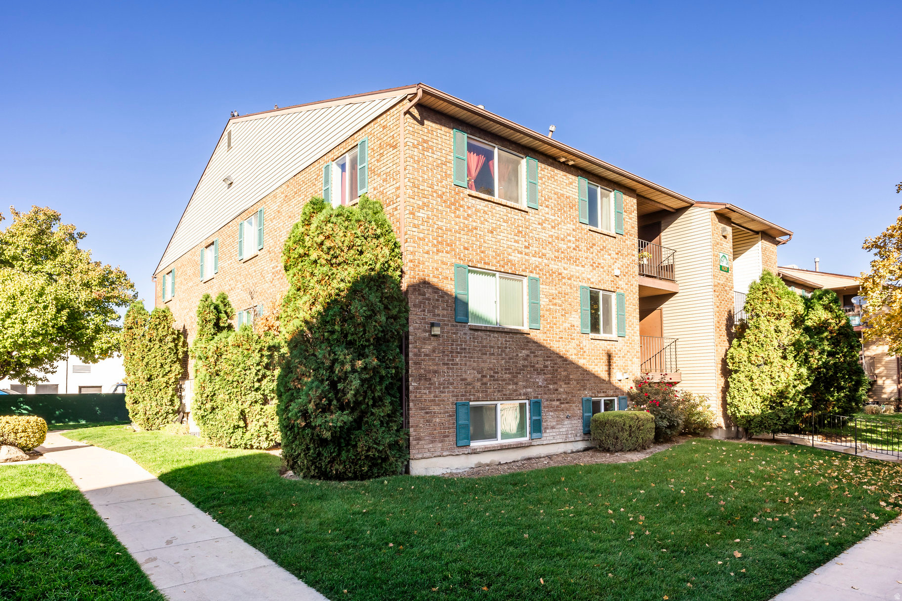 Centrally located in the heart of Taylorsville, this spacious three-bedroom, two-bath top-level condo offers comfortable, move-in-ready living. Enjoy a bright open layout with vinyl and laminate flooring throughout, a large primary suite, and generously sized bedrooms. The private deck includes a rare oversized storage room and in-unit laundry for added convenience. Community amenities include a pool, tennis court, and beautifully maintained grounds-ideal for easy, low-maintenance living with quick access to shopping, dining, and commuter routes.