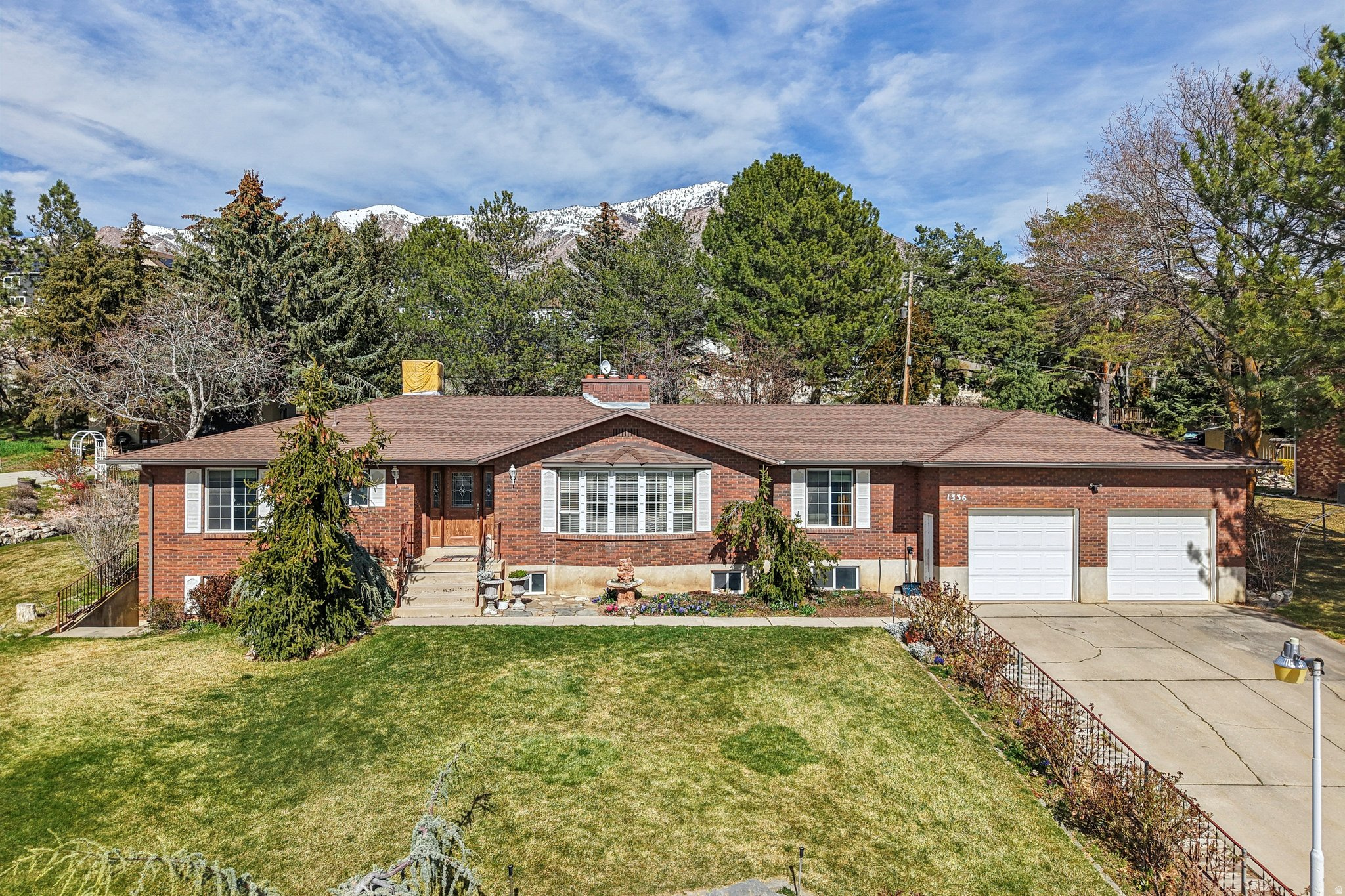 Large yard with a variety of fruit and nut trees and a large garden. Well maintained all brick rambler in a great quiet neighborhood. Spectacular valley and mountain views. Spacious home with a finished basement with 2nd kitchen.  Big shop with 240V. Evergreen trees provide peaceful seclusion. Agent is related to the sellers.