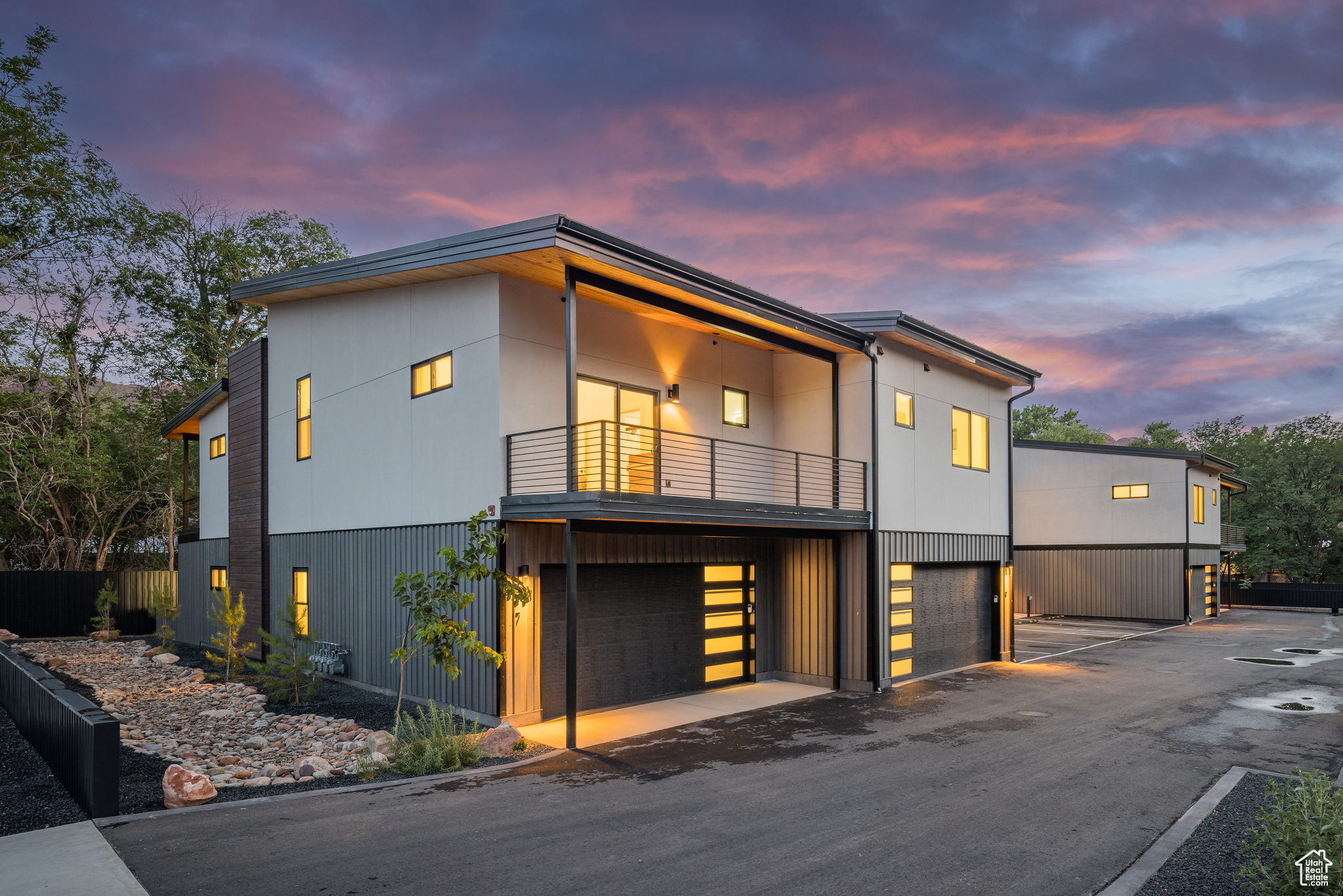 COTTONWOOD CONDOS - Welcome to an extraordinary living experience at Cottonwood Condominiums! Tucked in a quiet, tree-lined enclave centrally located in the heart of Moab, Utah, the Cottonwood Condos offers a rare opportunity to enjoy quiet in-town living with convenient access to renowned outdoor adventure destinations. Relax from your private patio under the cottonwood trees or take to the trails right from your doorstep! This stunning 3-bedroom, 2.5-bath condo was designed with upscale comfort and style in mind, featuring high-end finishes throughout-including wide-plank LVP flooring, sleek modern fixtures, and top-of-the-line stainless steel appliances in the gourmet kitchen. The thoughtful reverse floor plan is the ideal layout for privacy and functionality: the spacious primary suite is located upstairs, complete with a spa-inspired en-suite bath, walk-in closet, and private balcony. Downstairs, two generously sized bedrooms share a full bath-perfect for guests, home office space, or loved ones. Phenomenal outdoor spaces with additional living room balcony patio and ground floor patio! This incredible opportunity to live exceptionally in Moab next to the Mill Creek Parkway provides close access to the local ball fields, library, boutiques and restaurants, with Arches and Canyonlands National Parks only a short, scenic drive away. The perfect basecamp, with a two car garage with electric vehicle charging, for those who seek luxury living and expansive access to adventure!