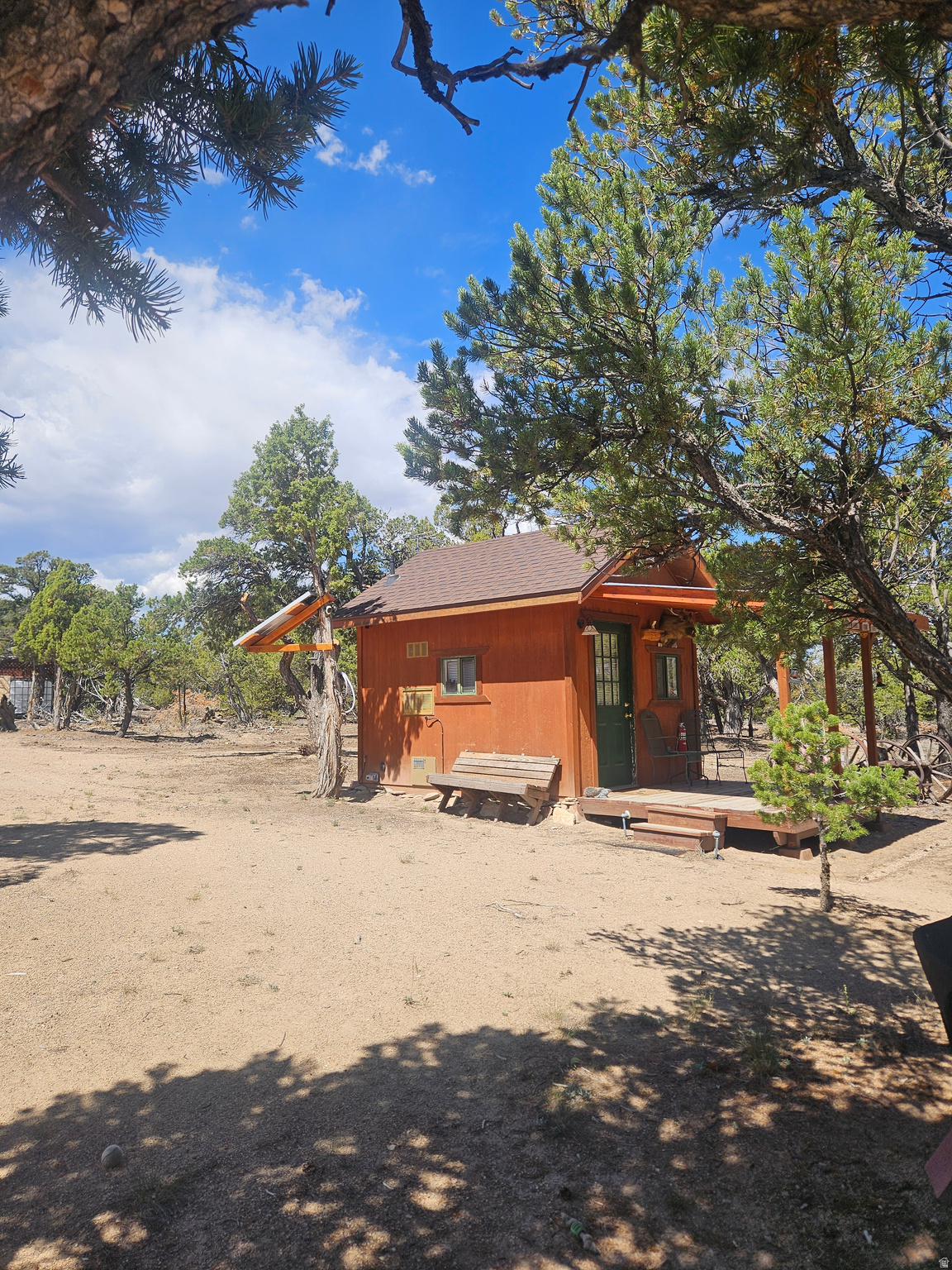 Cabin in the woods! 10 acres of heavily treed land on Something Drive. Drive way in with a round about. Cute little cabin bunkhouse ready for you to enjoy. Firepit, and storage container. Bring your toys and enjoy the quiet.