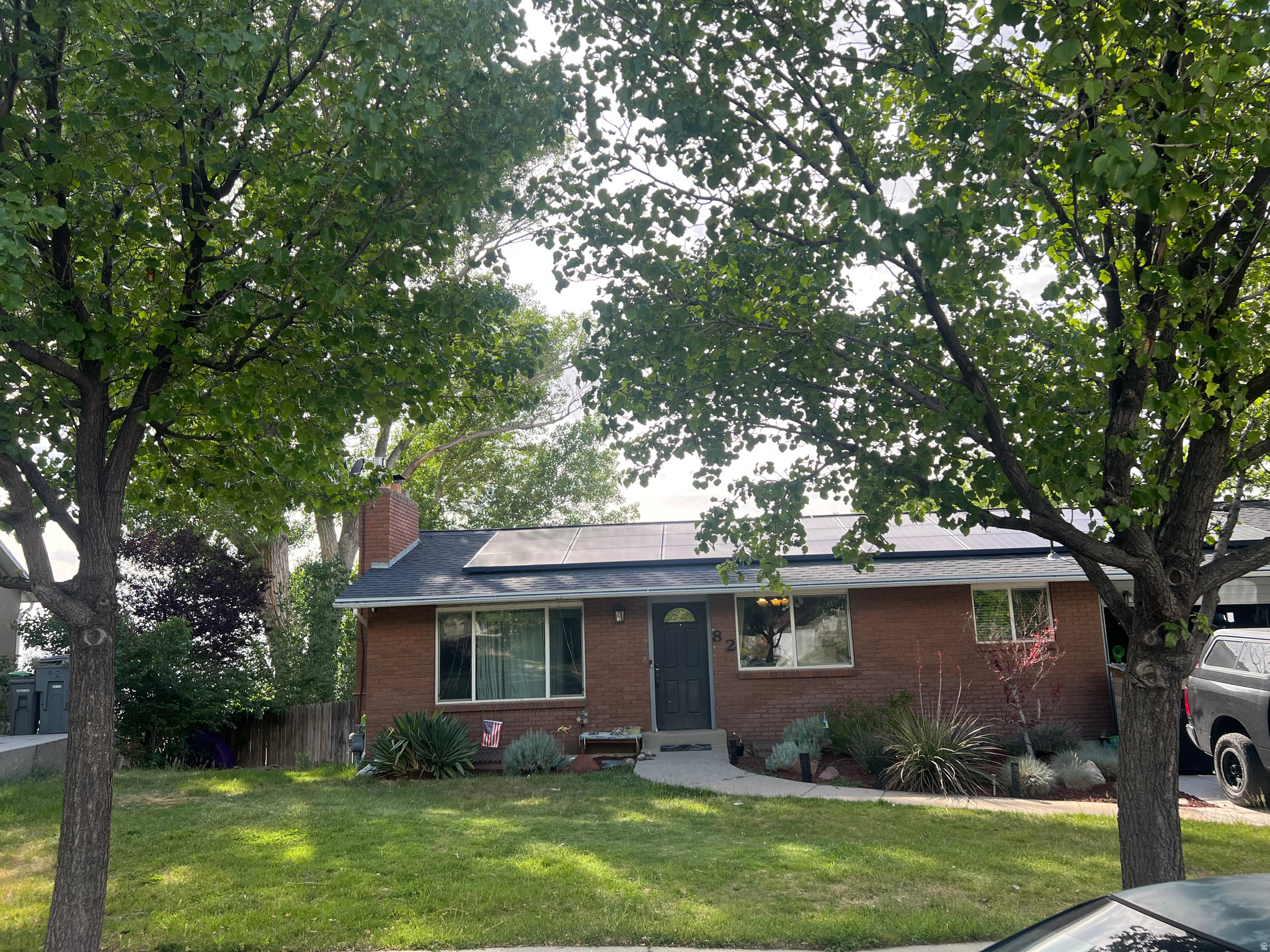 Perched high on the East Bench and just 0.06 miles from Edgewood Golf Course, this charming home offers breathtaking west-facing valley views and incredible potential. The fully fenced, tiered backyard features two raised garden beds, creating a perfect space for gardening, entertaining, or simply enjoying the scenery. Inside, the walkout basement has been thoughtfully updated and is ideal for a future mother-in-law suite or separate apartment. It includes newer appliances, a mini kitchen, a cozy gas fireplace, a spacious entertainment area, two bedrooms, an updated bathroom with a deep freestanding soaking tub and elegant finishes, plus a dedicated laundry area with front-loading washer and dryer. The main level features a spacious primary suite with an updated ensuite bathroom, an additional bedroom and full bath, and a well-appointed kitchen with stainless steel appliances. The large living room is anchored by a warm wood-burning fireplace, creating an inviting gathering space. Whether you're a first-time buyer or looking for a home with room to expand and customize, this property offers an exceptional opportunity to create your dream home in a desirable East Bench location with spectacular views. Square footage figures are provided as a courtesy estimate only and were obtained from county records.  Buyer is advised to obtain an independent measurement.