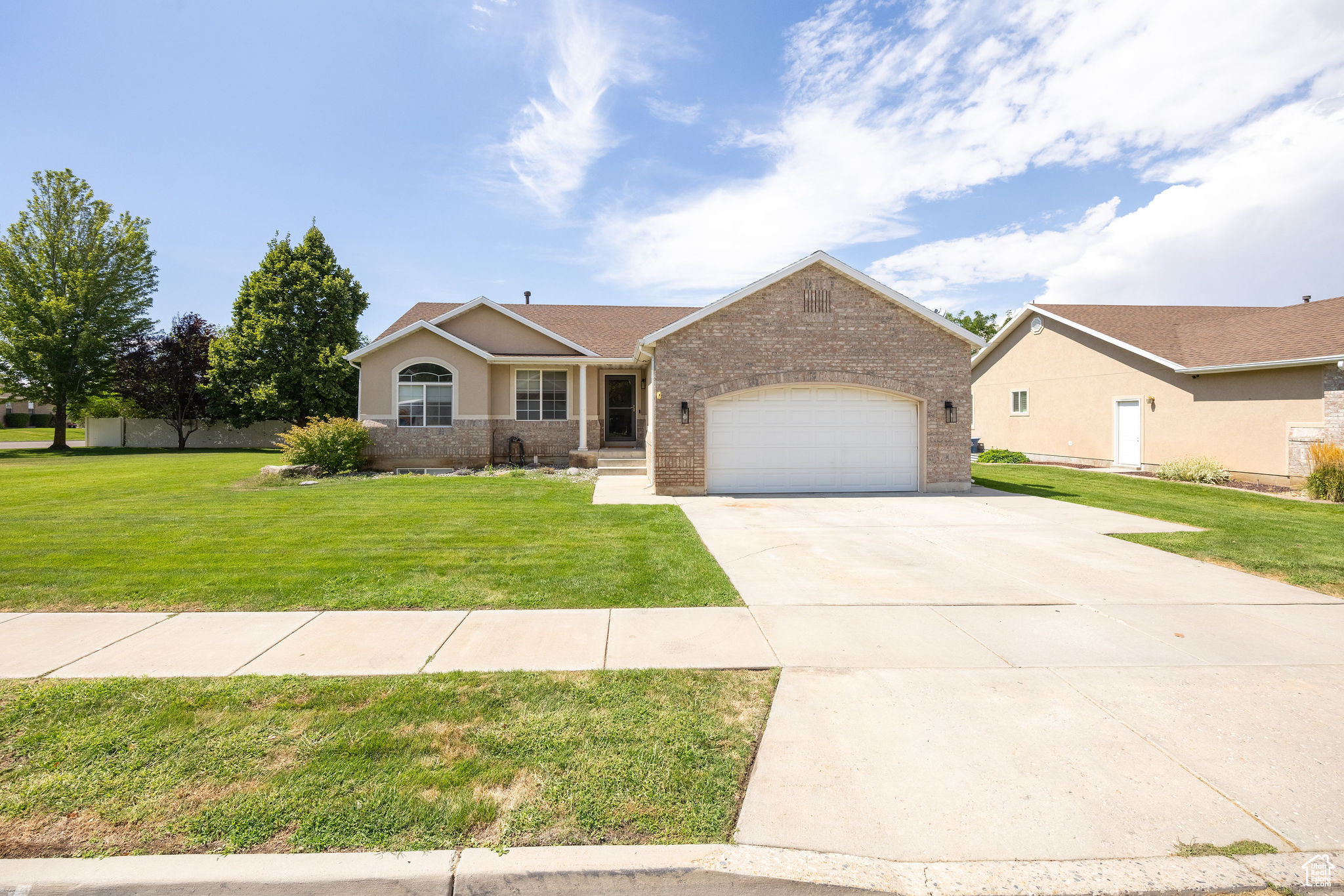 Welcome to this immaculate 4-bedroom + Den/office 3-bathroom Perry rambler located in a well-maintained, family-friendly HOA community that includes lawn care and snow removal for easy, low-maintenance living. This thoughtfully designed home offers convenient main-level living with the kitchen, living areas, primary suite, and laundry all on one floor. The newly updated kitchen features bright dining area with access to a covered deck. The partially fenced back patio allows for additional privacy & is plumbed for a Jacuzzi! The fully finished basement offers a large open family room along with an oversized cold storage