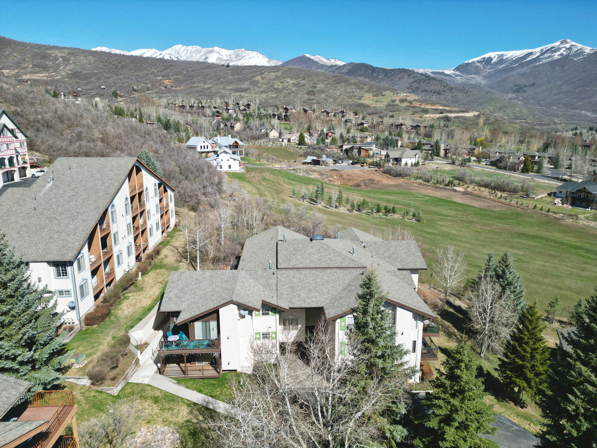 Mountain views, vaulted ceilings, and low-maintenance living in Midway's desirable Swiss Oaks community. Gorgeous condo features a cozy gas fireplace, double oven, in-unit laundry, private balcony, and one of the largest private storage units in the development-ideal for owners and guests alike.  Enjoy resort-style amenities including a clubhouse with spa, sauna, steam room, fitness center, and pickleball. HOA covers high-speed internet, snow removal, pest control, and more-making this an excellent second home or investment property. Furniture is negotiable and pets are allowed with restrictions.Minutes to Midway, Park City, skiing, golf, and year-round recreation. Square footage provided as a courtesy estimate; buyer to verify.
