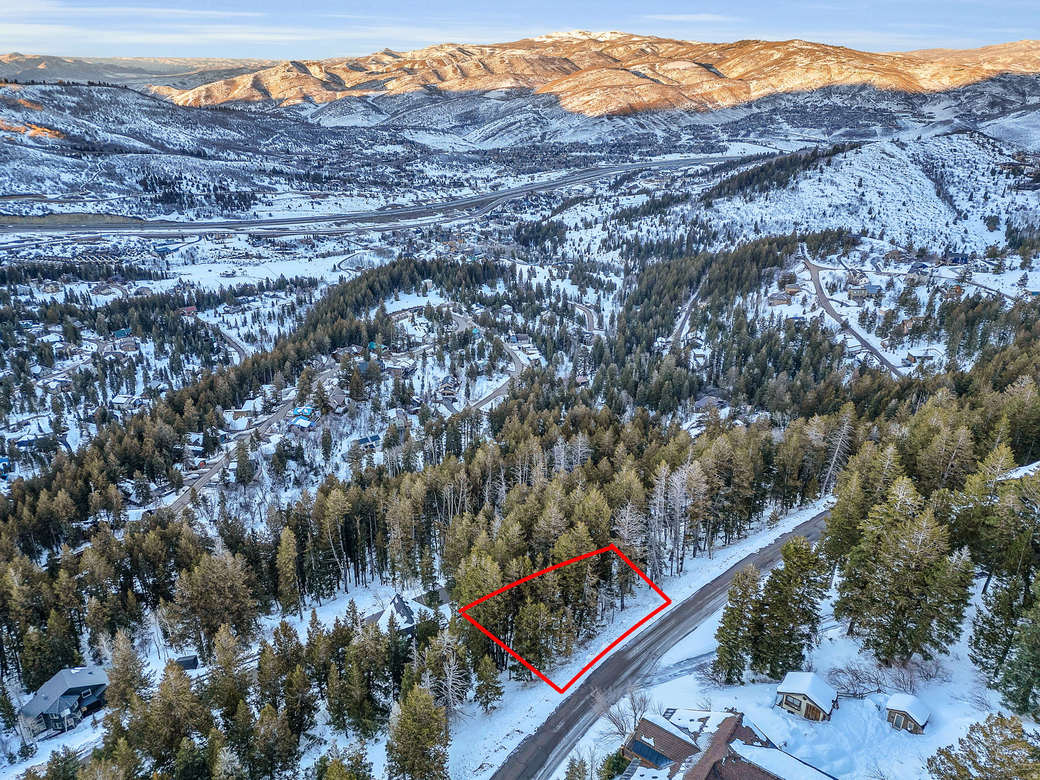 "Between every two pines is a doorway to a new world." - John Muir Create your own mountain retreat in Summit Park, where towering pines, fresh alpine air, and serene mountain views provide a rare sense of privacy and escape. Surrounded by nature yet conveniently located just minutes from Park City's dining, shopping, and world-class recreation-and only 30 minutes from Salt Lake City-this exceptional homesite offers the best of both worlds. Unlike many mountain lots, this homesite offers road access from two sides, creating flexibility for either an uphill or downhill design and helping unlock multiple building options. Preliminary  concept plans for a charming A-frame cabin are included, or bring your own vision and design the mountain home you've always imagined. Enjoy immediate access to hiking, mountain biking, snowshoeing, and backcountry skiing, all from one of Park City's most beloved mountain communities. Deer Valley, Park City Mountain, Woodward Park City, and Historic Main Street are all within easy reach, making this an ideal setting for a full-time residence, mountain getaway, or long-term investment.