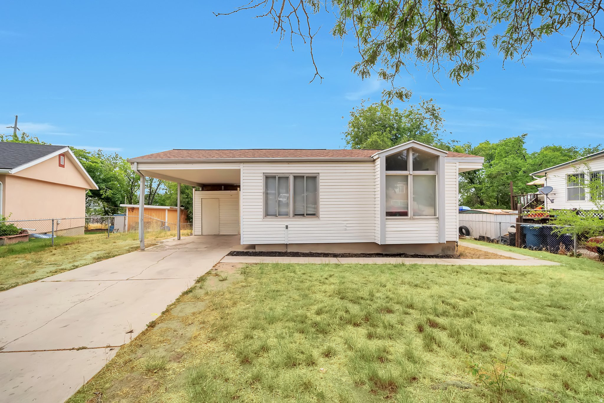 Priced to offer instant equity! Welcome to this charming 3-bedroom, 1-bath bungalow located in the heart of Sandy! This  home features newer carpet, and a newer refrigerator included for comfortable everyday living.  A new A/C unit was also installed October 2025. The kitchen is equipped with a dishwasher, and the home also includes a washer and dryer conveniently located in the basement.  Enjoy the added flexibility of a spacious unfinished basement - perfect for extra storage, a home gym, workshop space, or future expansion potential. Outside, the property includes a covered 1-car carport. The location is close to shopping, dining, parks, schools, and easy freeway access.  Square footage figures are provided as a courtesy estimate only and were obtained from County Records .  Buyer is advised to obtain an independent measurement.
