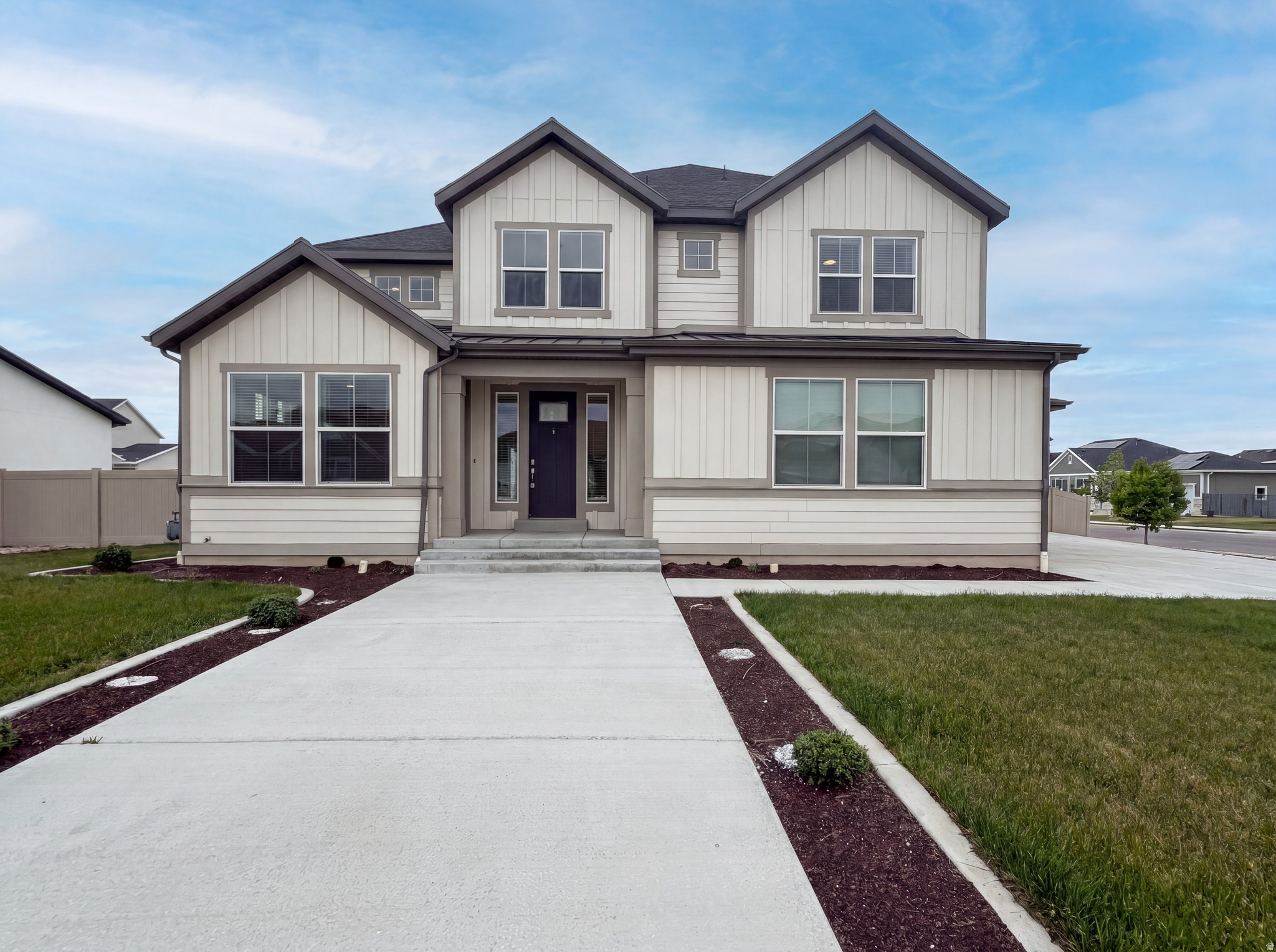 Check out 1251 N 2525 W, a residence with a functional layout providing practical comfort. It features a fireplace, and the kitchen includes an island with stainless steel appliances and an accent backsplash. The primary bedroom contains a walk in closet, while its bathroom is equipped with double sinks, a separate tub, and a shower. An exterior deck extends to a fenced in backyard. Experience comfort and style in this thoughtfully designed residence.  Included 100-Day Home Warranty with buyer activation
