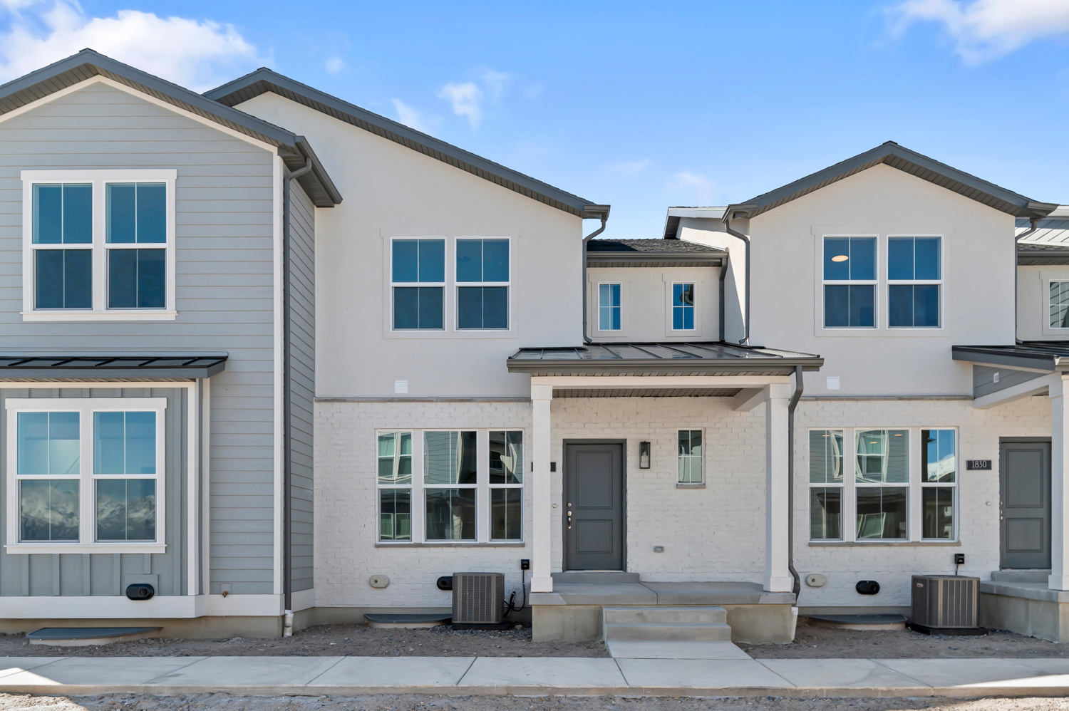 Discover the modern charm of the Bellevue Townhome all in a great Lehi community! This thoughtfully designed home includes durable laminate hardwood, vinyl tile, and carpet flooring, along with energy-efficient features like a tankless water heater. The modern kitchen features sleek gray laminate cabinets, quartz countertops and stainless steel gas appliances. Additional highlights include a stylish half wall at the stairway, Craftsman base and casing, and an owner's bathroom with cultured marble shower surrounds and satin & brushed nickel hardware. Comes fully landscaped all near shopping, schools parks and more at a great price!