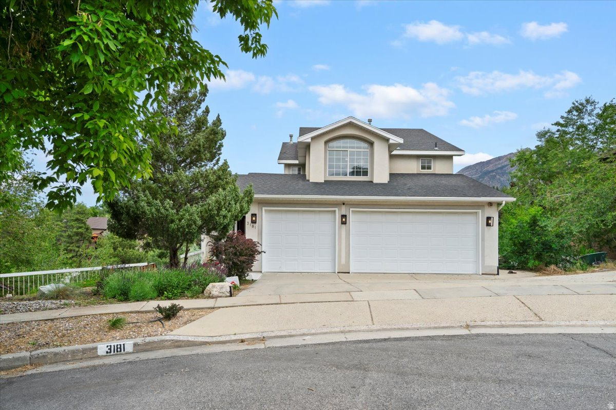This is a large, two-story home with great mountain views, located on a quiet cul-de-sac in the east bench of Cottonwood Heights. The home has 5 bedrooms and 3 bathrooms, with about 3,800 square feet of living space. Inside, the house is bright and open, with high ceilings and lots of natural light. The main floor includes an office that could also be used as a sixth bedroom, a large living room and dining area, and a kitchen with bar seating and a breakfast nook. There are hardwood floors, a laundry room with a washer and dryer, and two furnaces that allow separate temperature control for different areas of the home. Upstairs, the primary bedroom is spacious and has excellent mountain views. The attached bathroom includes a jacuzzi tub, a separate shower, and two sinks. There are also two additional bedrooms and a full bathroom on this level. Walk-out basement with abundant natural light, offering a new kitchen, two bedrooms, full bath, and a large family room, perfect for a mother-in-law suite, guest quarters, or multi-generational living. It has an infrared sauna and laminate flooring throughout. The home has a three-car garage and is close to hiking trails, shopping, and ski areas, while still offering a quiet and private setting. Seller financing is available.