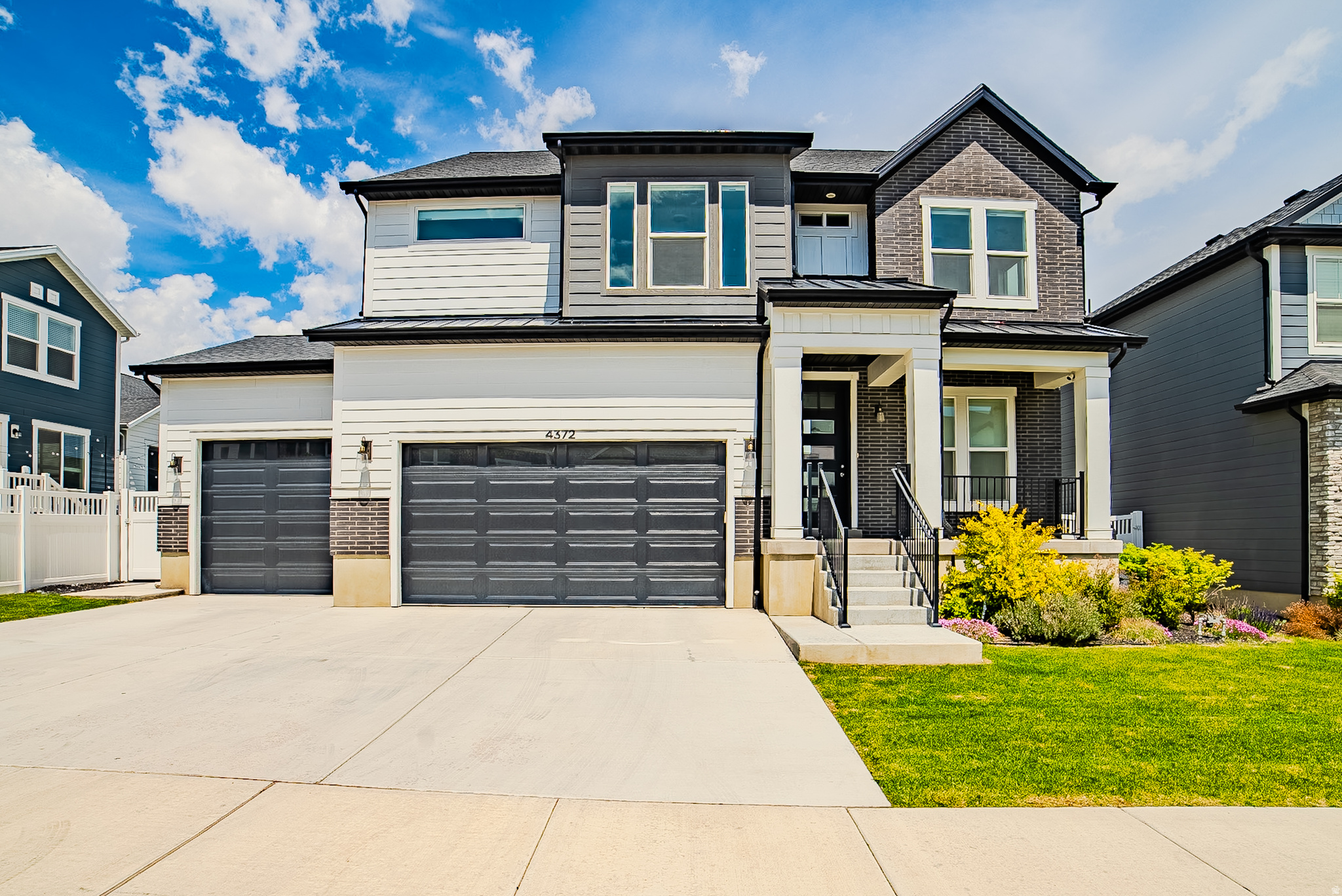 Modern design and flexible living come together in this impressive Herriman home, ideally located between Bangerter Highway and Mountain View Corridor, just minutes from Mountain View Village with shopping, dining, and entertainment. The bright open main level features soaring ceilings, oversized windows, a stunning floor-to-ceiling fireplace, and a chef's kitchen with abundant cabinetry, bold finishes, and a large island built for gathering. The spacious upper-level loft adds versatile living space, while the luxurious primary suite offers a spa-inspired bath with soaking tub and oversized walk-in shower. The fully finished basement includes a beautiful ADU with its own separate walkout entrance, creating exceptional flexibility for multi-generational living, guests, or rental potential. Outside, enjoy a fully fenced backyard with patio space, putting green, and mountain views.