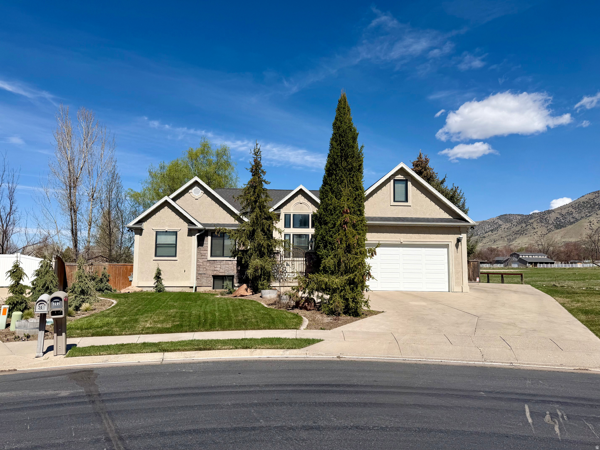 ONE PRICE, THREE PARCELS!! Craftsman charm meets country luxury-featuring incredible  well kept home with recent window paint, roof and landscaping upgrades, a stunning custom 1680 sq ft barn, a dream shop with 900 sq ft, open pastures, water share, and full RV hookup for ultimate convenience MUST BE SOLD WITH TAX PARCEL #'S - 02-096-0078 & 02-096-0083, Total all three parcels 1.70 Acres.