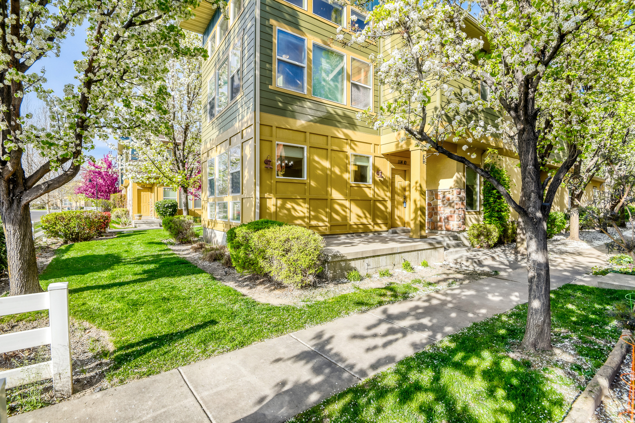 Welcome to this beautifully updated end-unit townhome in the highly desirable Farmington Crossing community. Offering 1,740 sq. ft, this is one of the largest floor plans in the development, filled with natural light from abundant windows and high ceilings that create an open feel throughout. Recent updates include brand new carpet, fresh paint, updated window coverings, and a new LG washer and dryer, making this home truly move-in ready.  The thoughtful layout features a tasteful kitchen with a spacious pantry, generous dining area and a functional storage/mudroom just off the garage; an upgrade not commonly found in other units.  The oversized garage provides ample room for parking and storage.  Enjoy beautifully maintained landscaping and community mountain views, along with resort-style amenities including two pools, hot tubs, clubhouse, fitness center, NEW dog park, playground, community grills and more. Ideally located just minutes from Station Park, shopping, dining, Smiths, and easy access to highways.