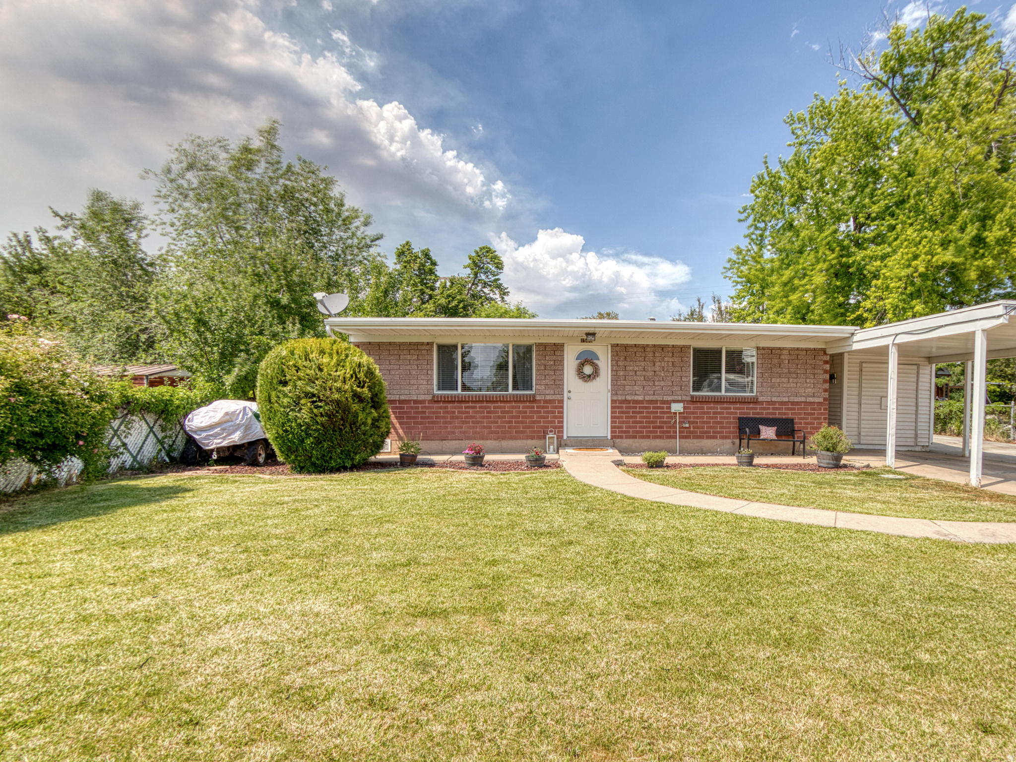 Multiple offers received, please send your highest and best offer by 06/04/26 not later than 3 pm. Please include eldarealtor@gmail.com & randyknowsutah@gmail.com  in the email.  STOP RENTING & START OWNING! Immaculate, move-in ready brick rambler in Layton featuring vaulted ceilings, updated kitchen, central air, RV parking, covered carport, storage shed, and a fully fenced 0.19-acre lot with beautiful landscaping & auto sprinklers. No HOA! Clean, updated, affordable, and full of value-this is the turnkey home buyers have been waiting for!