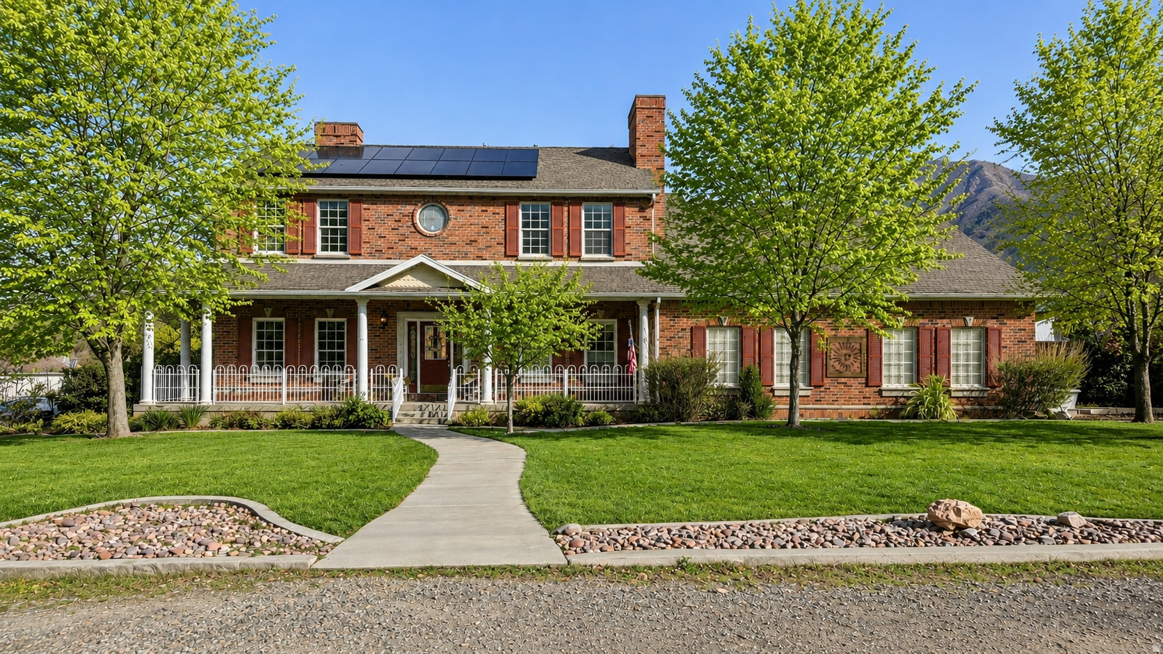 Don't miss your chance at this rare 1/2 Acre property featuring a fully finished 3,200 sq ft warehouse/shop! This brick 6 bedroom, 3.5 bath home offers just over 4,200 sq ft of living space with mountain views, a fully fenced yard, and incredible versatility. The insulated shop includes plumbing, HVAC, and a half bath, making it ideal for a business, workshop, storage, or hobby space. Recent updates include a renovated basement kitchen, remodeled primary bath, updated main-level half bath, restaurant-grade gas range, new furnace, and new A/C. The basement features a separate entrance through the garage, providing flexible living options. Additional amenities include a spacious 3-car garage, RV/trailer parking, paved sports court, owned solar system with battery backup and generator, security system, and ample parking. A truly unique property offering space, functionality, and endless possibilities. Contact us today for a private showing! Buyer to verify all information.