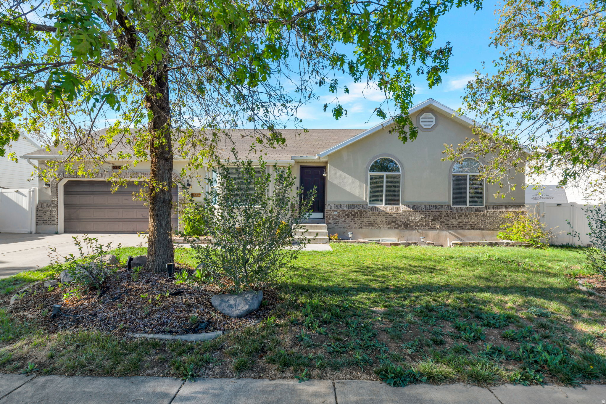 Welcome to 5244 W. Shaggy Peak Drive, Riverton, Utah! Discover this spacious and thoughtfully designed home offering 2,588 sq. ft. of living space with 5 bedrooms, 3 bathrooms, a 2-car garage, and dedicated RV parking. The main level spans 1,317 sq. ft. of comfortable, single-level living. It features 3 bedrooms, 2 bathrooms, a bright and inviting kitchen, convenient laundry room, and a warm family room-perfect for everyday living and entertaining. The fully finished basement adds 1,271 sq. ft. of flexible space, including 2 additional bedrooms, 1 bathroom, a spacious family room, and extra areas ideal for a home office, hobbies, or storage, ensuring everyone has room to spread out and enjoy. Set on a generous .21-acre lot, the property is surrounded by mature trees and fruit trees, creating a serene, established setting. The fully fenced backyard is designed for both relaxation and entertaining, boasting a patio, gazebo, storage shed, and a dedicated garden area-perfect for summer gatherings, gardening, or simply enjoying Utah's beautiful seasons. With its thoughtful layout, abundant space, and prime location near parks, schools, shopping, and major commuter routes, this home offers the perfect blend of comfort, convenience, and outdoor charm. Don't miss your chance to make this exceptional Riverton property your new home! Square footage figures are provided as a courtesy estimate only and were obtained from County Records. Buyer is advised to obtain an independent measurement.