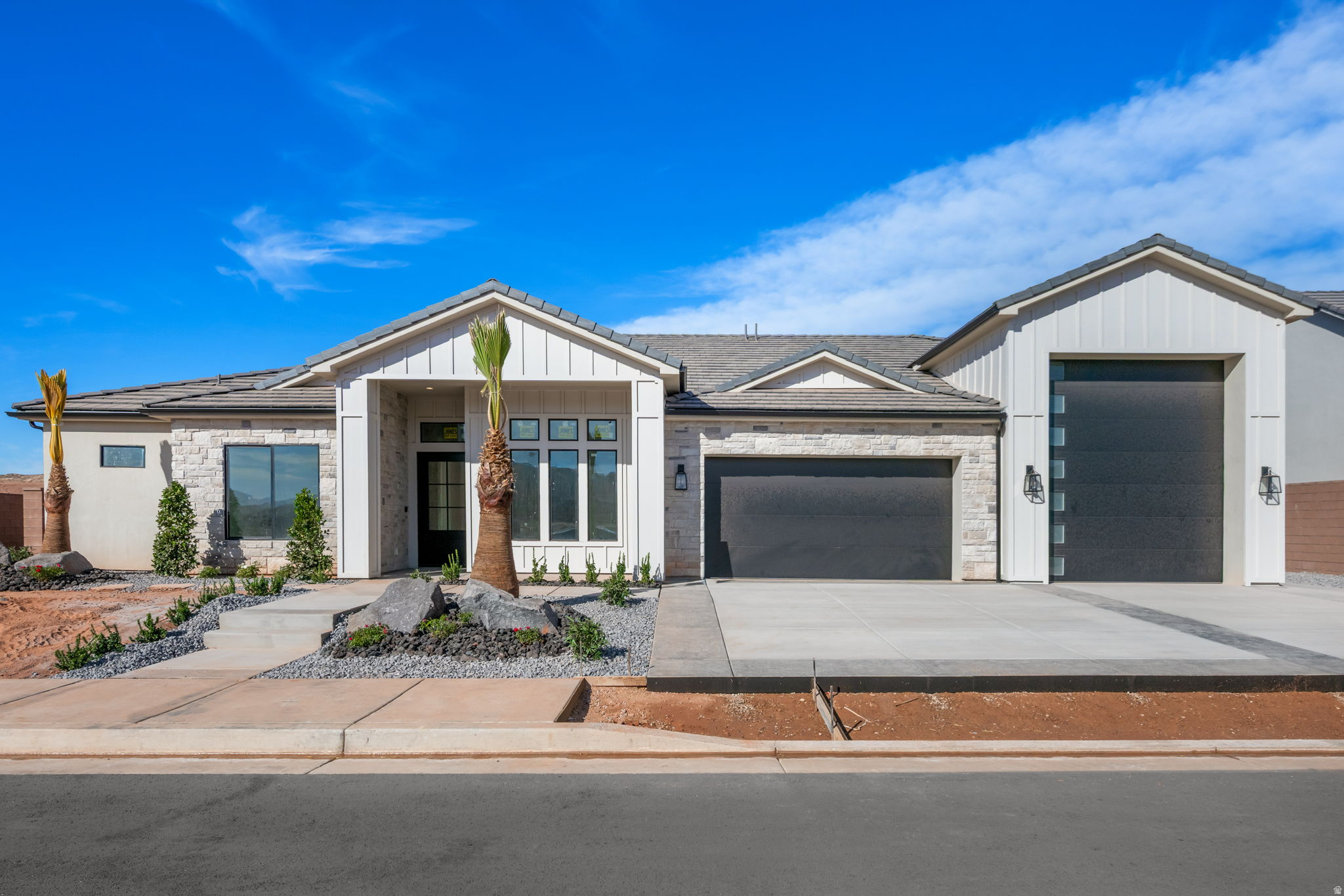 43' RV garage, pool-ready finished backyard & attached 2-bedroom guest house with full kitchen. Located in ALAIA Lakeside with 2 recreation lakes and adjacent Zion Shores Surf Resort. Dixie Power, 3 HVAC zones & tankless water heater.