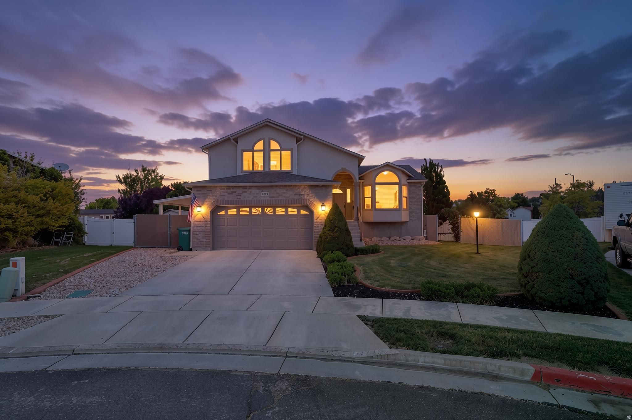 Pride of ownership is undeniable in this beautifully maintained one-owner home, thoughtfully designed to enhance comfort, efficiency, and natural light. From the moment you enter, you'll notice the intentional design featuring additional windows, including elegant bay windows, carefully added to flood the home with natural light and create a bright, open, and inviting atmosphere throughout.  This home offers 3 bedrooms plus a versatile basement flex room with an adjacent full bathroom. Whether you need a great room, family room, home office, or a potential fourth bedroom, this flexible space adapts to your lifestyle.  Buy with confidence knowing this home has been recently pre-inspected and features significant upgrades that provide lasting value and peace of mind, including a new roof installed in May 2024, brand-new energy-efficient triple-pane windows, and upgraded insulation completed in May 2026. These improvements work together to deliver exceptional energy efficiency, year-round comfort, and reduced utility costs.  Beautiful engineered hardwood floors add warmth and durability to the main living spaces, while custom wrought-iron gates and railings enhance curb appeal with distinctive character and charm. Every detail reflects consistent care and pride of ownership from the original owner.  Step outside to a private backyard retreat featuring mature landscaping, a spacious patio, and a convenient pull-down shade, creating the perfect space for relaxing, entertaining, or enjoying quiet evenings outdoors. This is a rare opportunity to own a truly move-in-ready home where thoughtful design, meaningful updates, flexible living space, and true pride of ownership come together in one exceptional package.  Conveniently located with quick and easy freeway access, this home offers excellent connectivity throughout the area. Nearby area highlights include the Hill Aerospace Museum, Hill Air Force Base, as well as a variety of shopping, dining, parks, and everyday conveniences.    Square footage figures are provided as a courtesy estimate only and were obtained from an appraisal.  Buyer is advised to obtain an independent measurement.