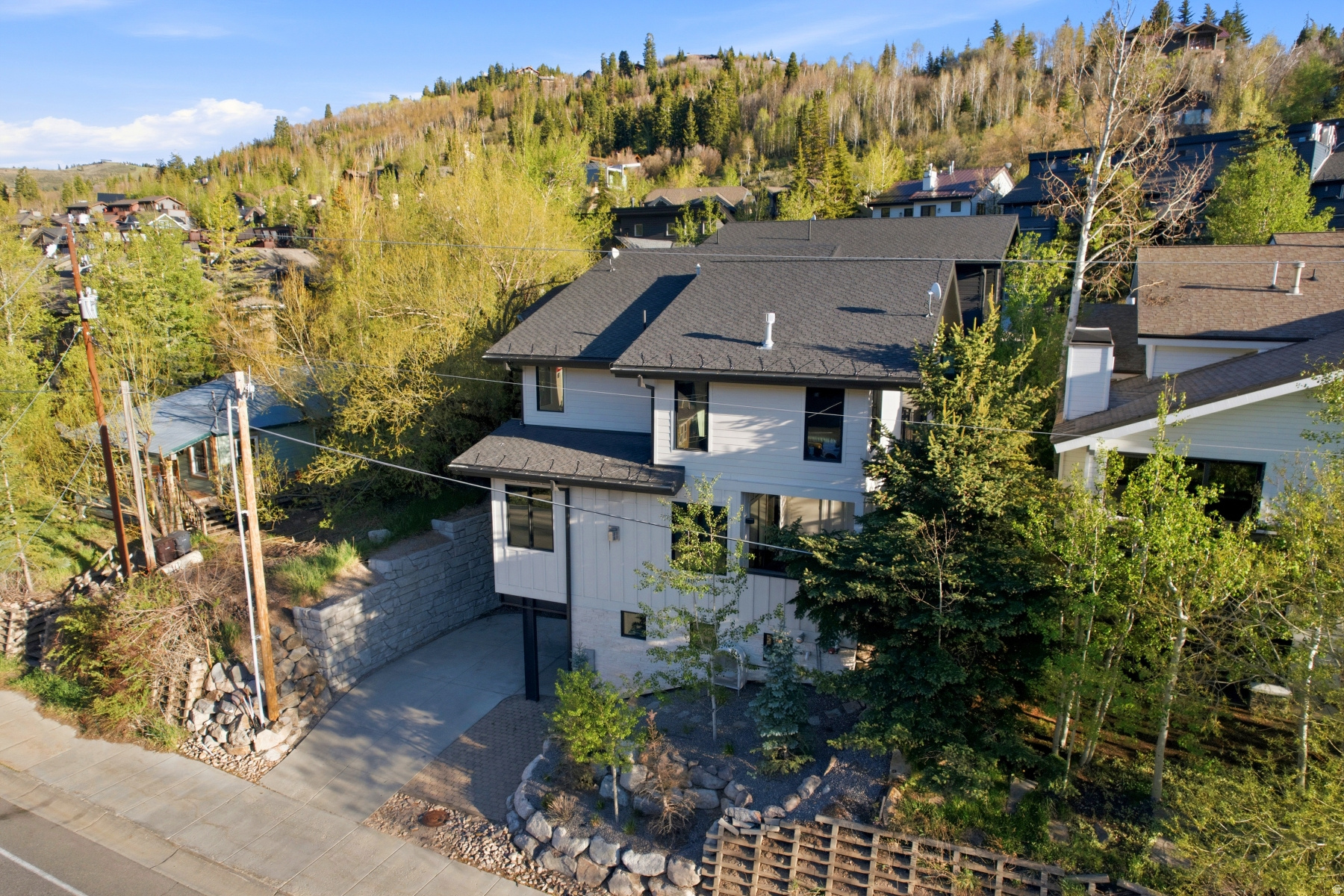 Imagine waking up in the luxurious third-floor suite of an elegant home on Deer Valley Drive, perfectly situated in Park City's historic Old Town. Designed to honor the legacy of this storied mining town, the home blends timeless charm with modern sophistication. Envision starting your day with breakfast prepared in a state-of-the-art chef's kitchen on the second floor, followed by a peaceful moment on the patio, sipping coffee as your family gears up for an exhilarating day on the slopes. With a private elevator connecting all levels, you can step out your front door and choose from two world-renowned ski resorts--Deer Valley or Park City Mountain--both just a quick two-minute bus ride from your driveway. This home is crafted for entertaining and hosting out-of-town guests, offering a thoughtful layout: the master and junior master suites occupy the upper level, two guest bedrooms are located on the lower level, and a versatile flex space on the main floor serves as an ideal fifth bedroom or home office. Designed by Brighton Architectural Group and meticulously built by Bailey Construction Park City, 552 Deer Valley Drive offers an unparalleled mountain-meets-city lifestyle. A short stroll takes you to Old Town's vibrant Main Street, where shopping, entertainment, and fine dining await. Outdoor enthusiasts will love the proximity to scenic trails, bike paths, and a variety of year-round activities--including a sunset round of golf just minutes away. For investors, the property's impressive rental performance adds an extra layer of appeal, offering the opportunity to share this exceptional retreat while generating significant returns. Full rental performance details are available. Call today to schedule your private tour of this remarkable property and begin living the Deer Valley dream.