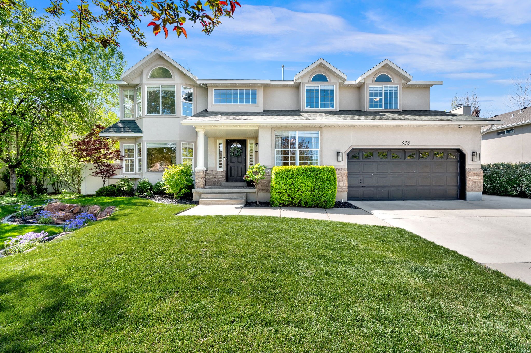 This remodeled home offers move-in-ready perfection in Draper's desirable Cranberry Hill neighborhood.  Over 3,600 square feet, 6 bedrooms, a private office, and thoughtful layout, it seamlessly balances elegant entertaining spaces with everyday comfort. Upgrades include hardwood flooring, new carpet, quartz and marble countertops, updated lighting, new interior paint, and designer finishes throughout. The highlight is the luxurious primary bathroom-a true spa-like retreat. Additional peace of mind comes from the recently updated water heater and furnace. Outside, smart/app-controlled exterior lighting creates customizable ambiance for any occasion. The backyard features mature trees, plus a spacious deck and fire pit-ideal for summer evenings or gatherings.  Two parks within walking distance, just minutes from Costco, Trader Joe's, Juan Diego, Lone Peak Hospital, and easy access to I-15. No HOA. This home combines style, functionality, and an unbeatable location-ready for you to simply move in and start making memories.