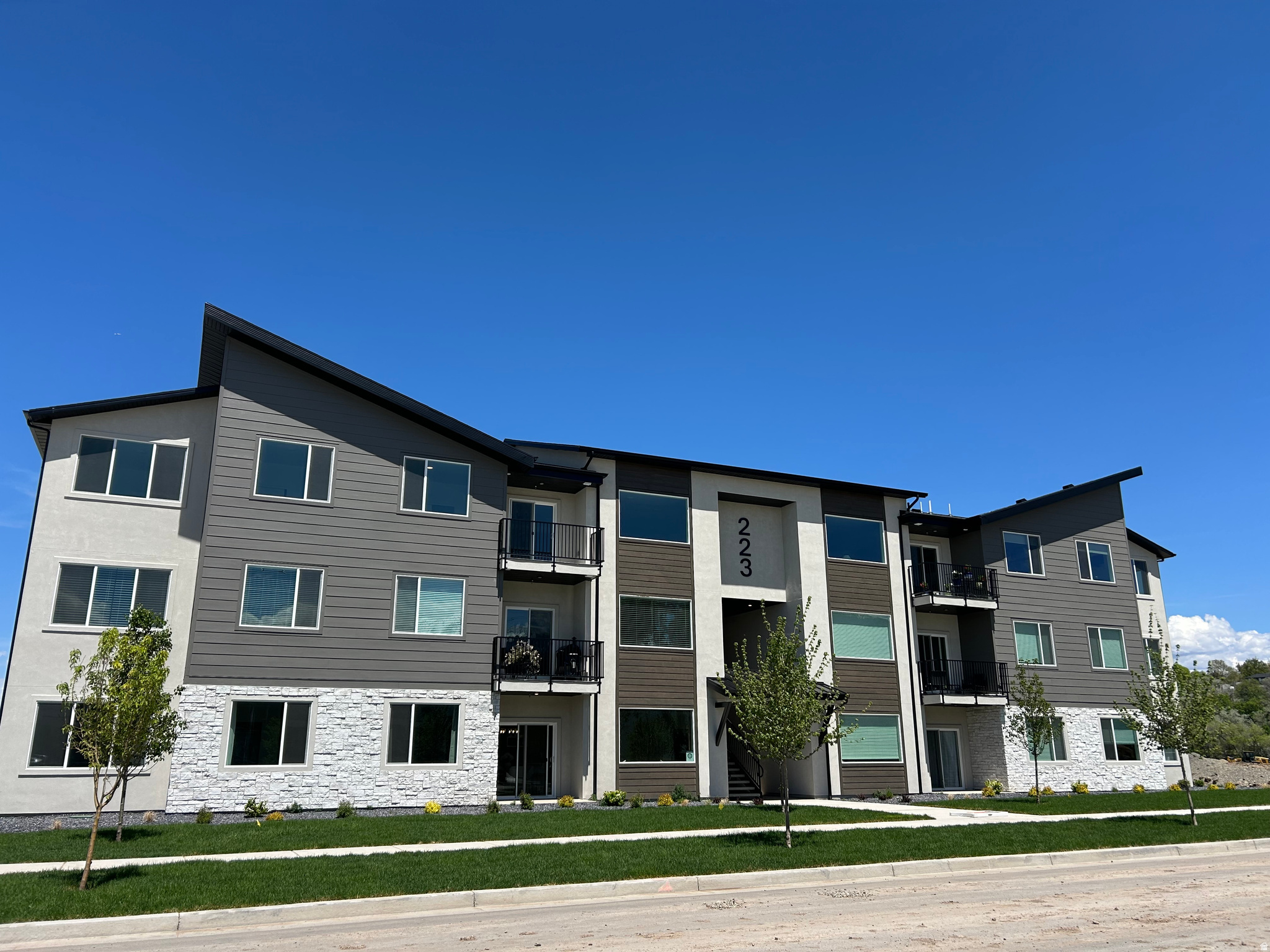 Beautiful new luxury condo currently under construction with an anticipated August completion! Receive a $9,600 flex incentive that may be applied toward closing costs, interest rate buy-down, purchase price reduction, prepaid HOA dues, or a combination of these options. Incentive is not tied to the use of the builder's preferred lender. Qualified buyers may also be eligible for a loan program featuring no mortgage insurance and a $10,000 down payment assistance grant. This thoughtfully designed condo showcases upscale finishes throughout, including expansive windows, 9-foot ceilings, quartz countertops, upgraded cabinetry, premium flooring +more. Enjoy an open, light-filled floor plan designed for modern living. Ideally located with convenient freeway access and just minutes from shopping, dining, and the new Spanish Fork Recreation Center. River Run offers exceptional resort-style amenities, including a beautiful clubhouse, swimming pool, pickleball courts, playgrounds, walking trails, and a dog park. Come tour our beautifully decorated model home today! Photos are of a decorated model and are provided for illustrative purposes only.