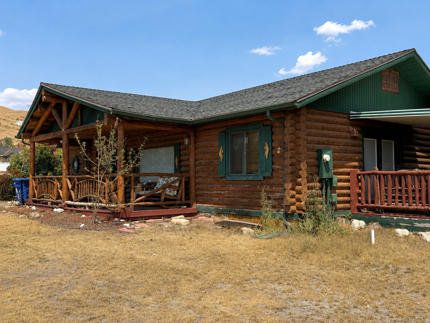 Welcome home to your own slice of country paradise! Nestled on a full acre in Herriman, this one-of-a-kind log cabin offers breathtaking mountain and valley views, timeless rustic charm, and room to live the lifestyle you've always dreamed of.  From the moment you arrive, you'll fall in love with the warmth of authentic log construction, soaring wood ceilings, expansive living spaces, and the cozy wood-burning stove that creates the perfect gathering place on chilly evenings. Every room showcases the character and craftsmanship that make this home truly special.  Step outside and enjoy peaceful mornings on the covered porch, endless sunsets, and panoramic views that stretch for miles. The property is zoned for horses and offers ample space for animals, gardens, toys, or future improvements. A rustic outbuilding adds even more versatility for storage, hobbies, or livestock.  Whether you're looking for a private country retreat, a horse property, or simply a home with room to breathe, this exceptional property delivers the perfect balance of rustic beauty and everyday comfort-all while remaining just minutes from Herriman's shopping, dining, schools, and recreation.  If you've been searching for a home with character, acreage, incredible views, and the freedom to enjoy country living without sacrificing convenience, this is the one you've been waiting for.