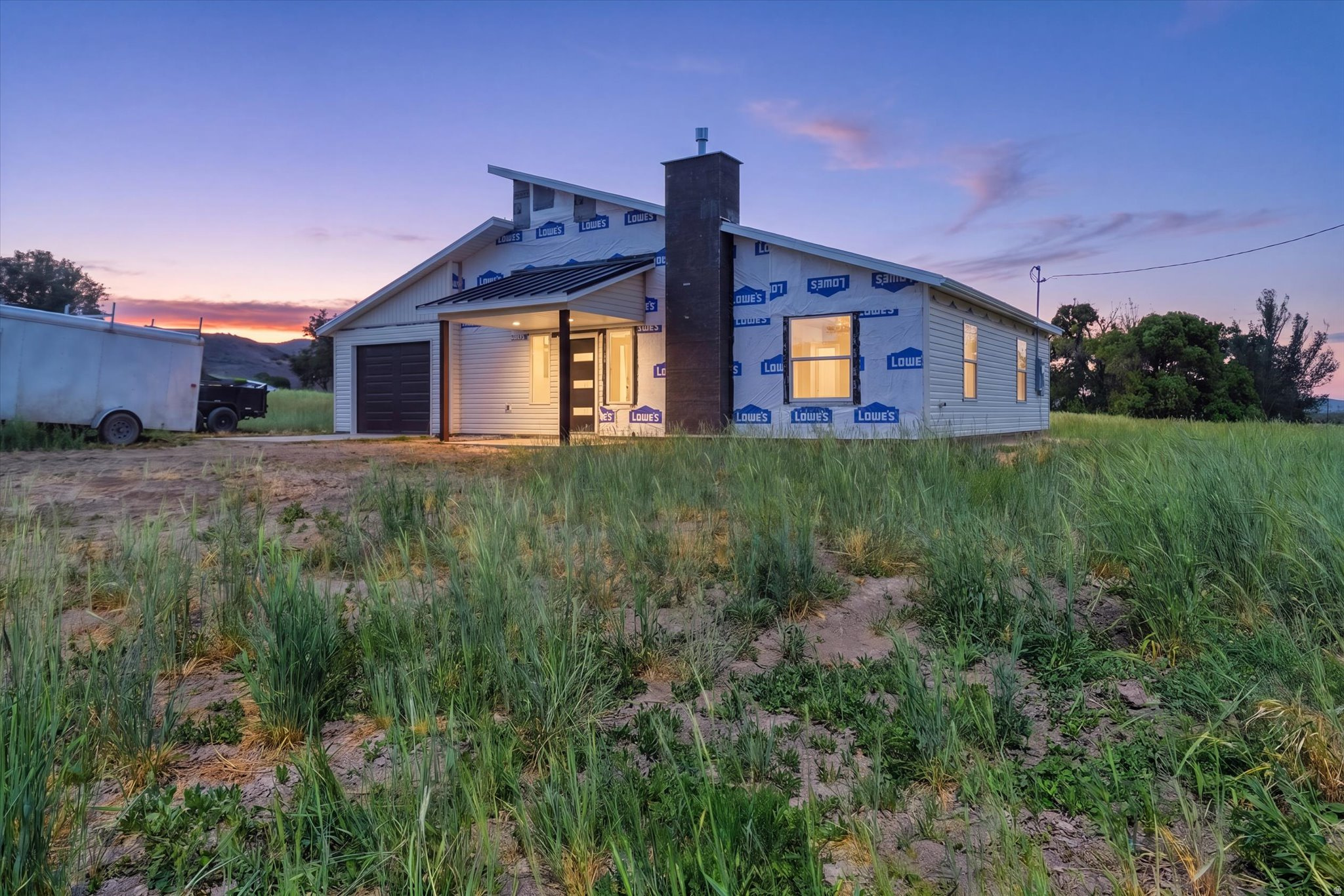 Say hello to your new home in beautiful Portage. Built in 2026, this stunning 3-bedroom, 2-bath home offers 1,510 square feet of thoughtfully designed living space with modern finishes throughout. Enjoy quartz countertops, durable LVP flooring, and the warmth of a cozy gas log fireplace. Situated on .86 acres, there's plenty of room to relax, entertain, and take in the incredible mountain views right from your backyard. Peaceful small-town living with space to breathe and views you'll never get tired of.