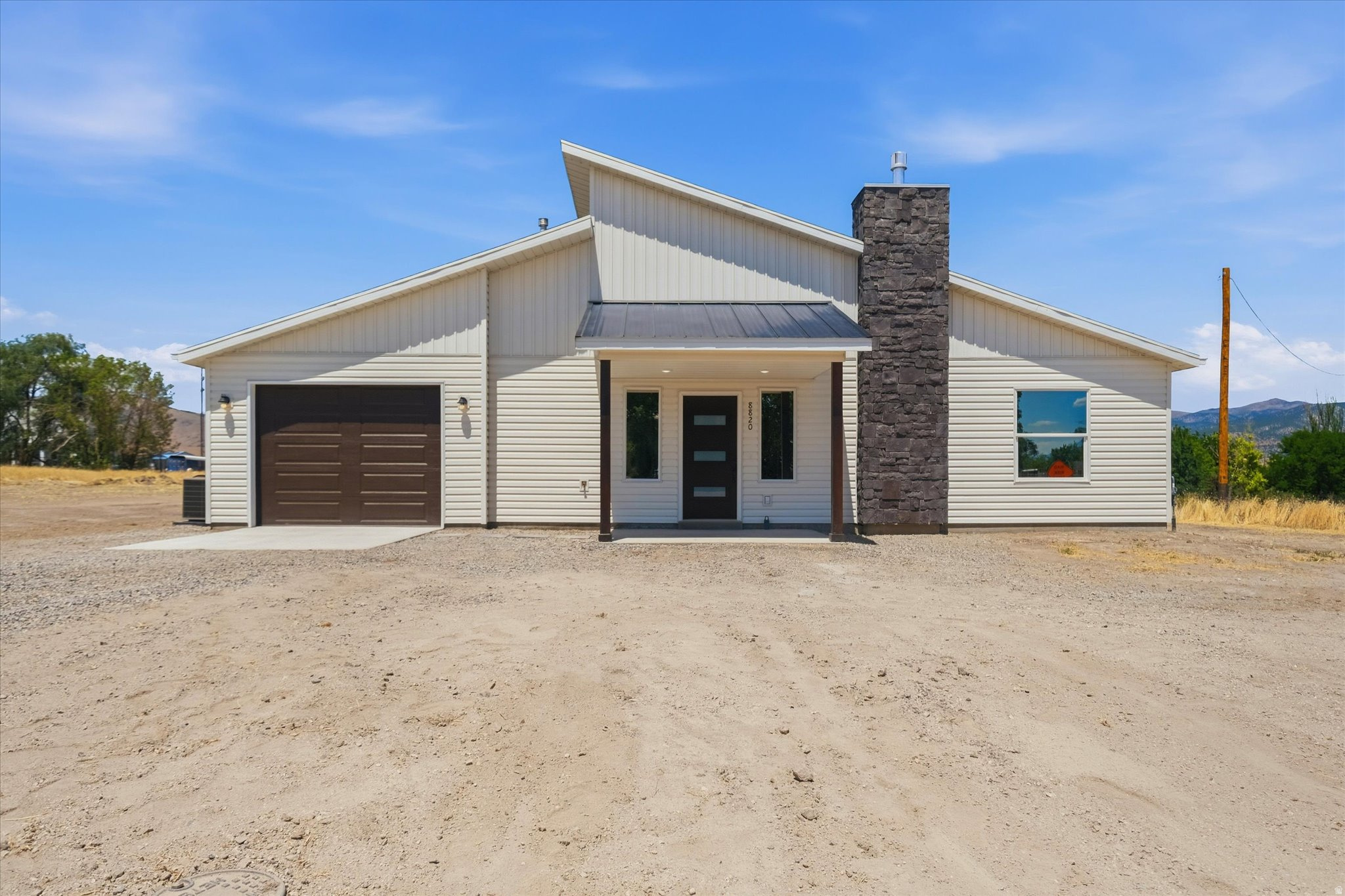 Say hello to your new home in beautiful Portage. Built in 2026, this stunning 3-bedroom, 2-bath home offers 1,510 square feet of thoughtfully designed living space with modern finishes throughout. Enjoy quartz countertops, durable LVP flooring, and the warmth of a cozy gas log fireplace. Situated on .86 acres, there's plenty of room to relax, entertain, and take in the incredible mountain views right from your backyard. Peaceful small-town living with space to breathe and views you'll never get tired of.