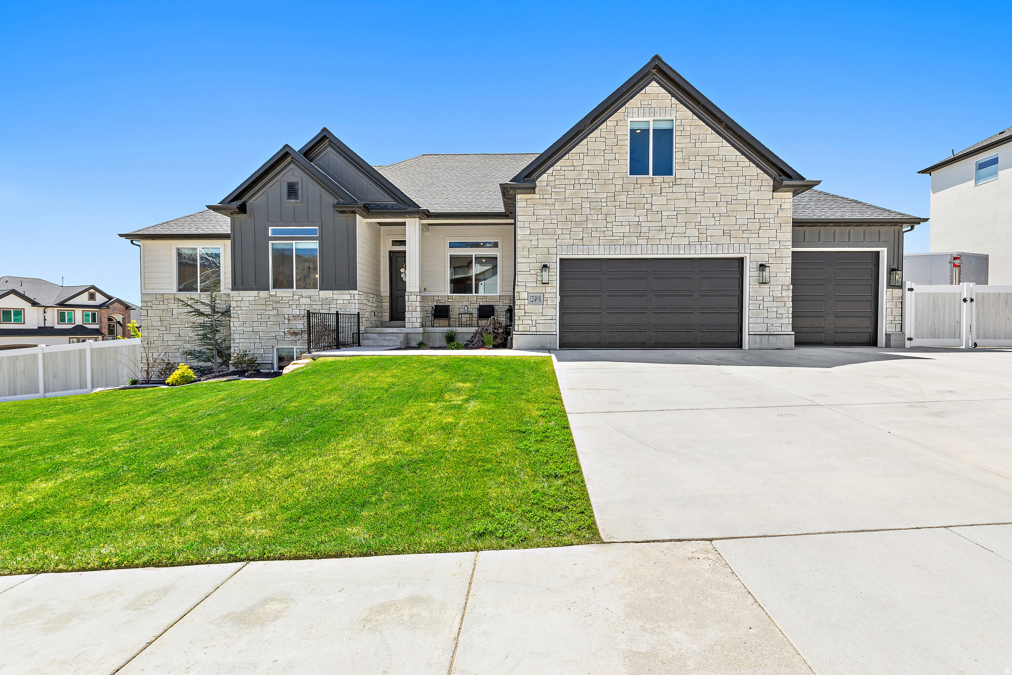 Fully finished home with beautiful, landscaped yard- no need for future expense! If you are searching for a beautiful newer home in Highland with stunning views and convenient single-level living, this is the one. The home features a gorgeous white oak kitchen complete with double ovens and a spacious island that seamlessly connects to the open dining area and great room, highlighted by vaulted ceilings. Expansive windows flood the home with natural light while showcasing the serene surroundings. Backing to a protected ravine where no future building can occur, the property offers exceptional privacy and natural beauty. The main floor includes three bedrooms, two and a half bathrooms and a den just off the foyer-perfect for a home office or flex space. Upstairs, you will find an ideal hangout area with an open loft, a large bedroom and a full bathroom, along with a charming hidden closet/play area connecting the spaces. The finished basement expands your living options with two additional bedrooms, a full bathroom, a wet bar, and a massive family room-perfect for entertaining. A walk-out basement with sliding doors brings in even more natural light and provides easy access to the backyard. Outdoor living is just as impressive, featuring a deck off the main level with sliding doors and a natural gas hookup for your grill. The thoughtfully designed terraced yard includes a Bullfrog hot tub and an extra-large gas fire pit under a custom-built pergola-ideal for relaxing or hosting gatherings. Completing the home is a spacious 3-car garage with an extra-deep tandem third bay, offering plenty of room for vehicles, storage, and recreational toys. Owner/agent Square footage figures are provided as a courtesy estimate only and were obtained from builder floorplans.  Buyer is advised to obtain an independent measurement.
