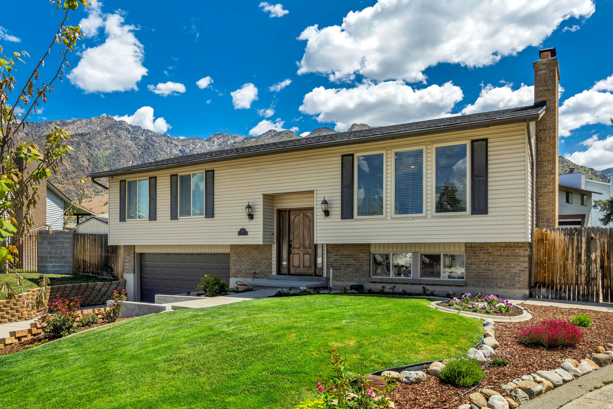 Perched at the top of a quiet cul-de-sac, this Cottonwood Heights split-entry offers privacy, views, and an ideal layout for both everyday living and entertaining. A beautifully remodeled kitchen opens the floor plan, creating seamless flow between the living and dining spaces while capturing breathtaking mountain views from the kitchen and primary bedroom. Featuring top-quality finishes, stunning hardwood floors, and thoughtful updates throughout, this home has been completely and meticulously renovated with pride and precision. Situated on an expansive flat yard, the outdoor living spaces are equally impressive. Enjoy a spacious deck, fenced yard, vegetable garden area, tranquil water feature, and a secluded backyard retreat.  Walk to Bywater Park's tennis courts, playground, and open green space, or take advantage of the nearby Cottonwood Heights Recreation Center with its indoor and outdoor pools. Perfectly positioned near Big Cottonwood, Little Cottonwood, and Ferguson Canyons, you'll enjoy quick access to hiking, biking, skiing, and year-round outdoor recreation while avoiding much of the canyon traffic. Convenient access to I-215 places the University of Utah, downtown Salt Lake City, Salt Lake City International Airport, premier shopping, dining, and world-class ski resorts just minutes away. Combining spectacular views, exceptional updates, outdoor amenities, and an unbeatable location, this is a rare Cottonwood Heights opportunity you won't want to miss.