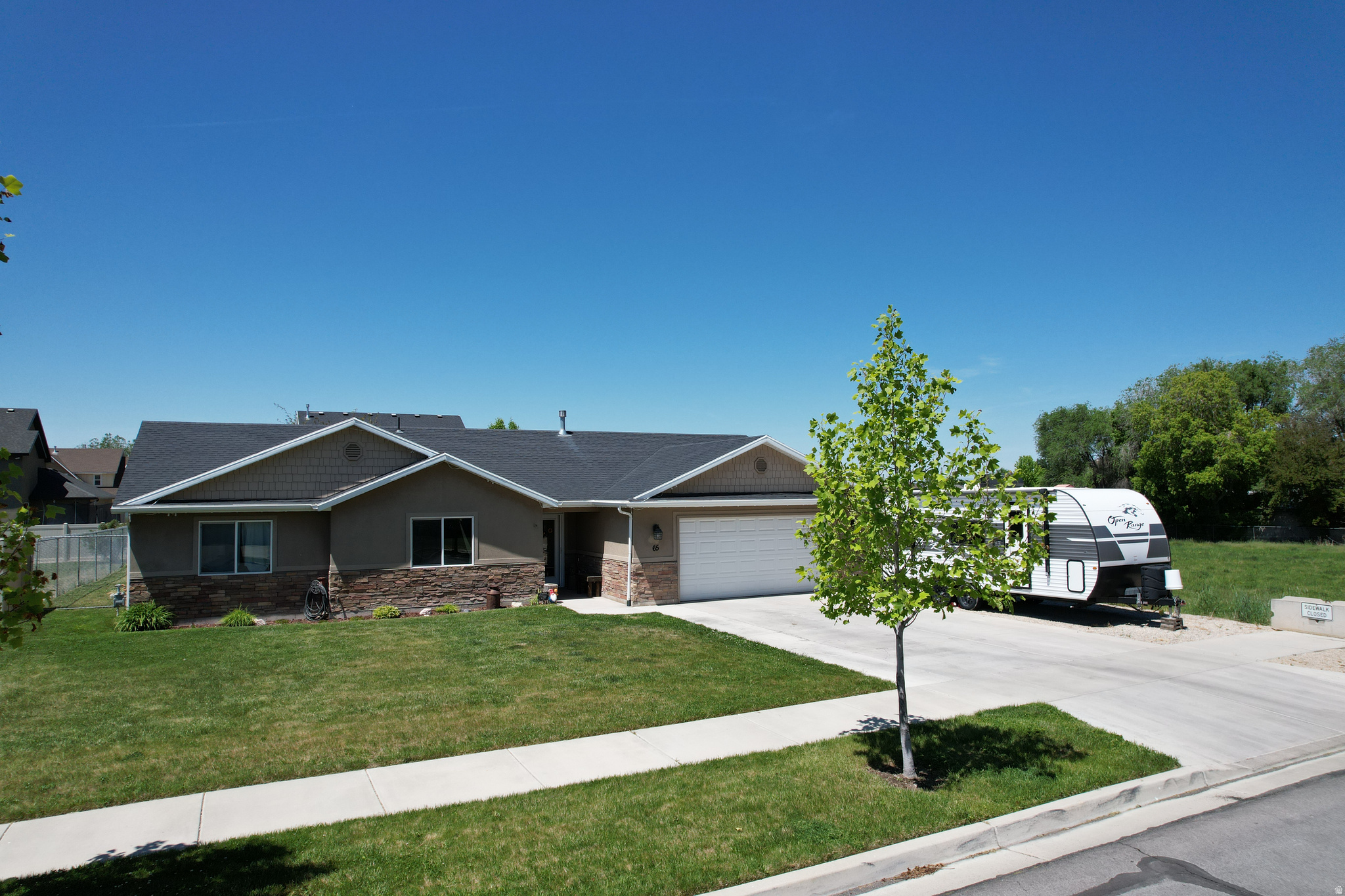 ** Open house Saturday May 30th 1230 to 230 pm!** The home you have been waiting for!  2014 Rambler built on grade so it is easy to get in and out of the home.  Single level living at it best with 3 foot wide doors for primary suite, front door and garage door! Only 1 step into the home! 2023 large shower upgrade to make it even better in 2nd bath.  Hard surface floors are ideal. Granite countertops, vaulted ceiling, gas range, oversized attached garage, fenced yard, covered patio space, RV Parking, dead end street in a great location next to open field, reverse osmosis water filter, water softener (conveniently in garage), solar panels to save on utility costs (paid off solar), New High efficiency Furnace and AC in 2023!  Such a great house, you are going to love it.