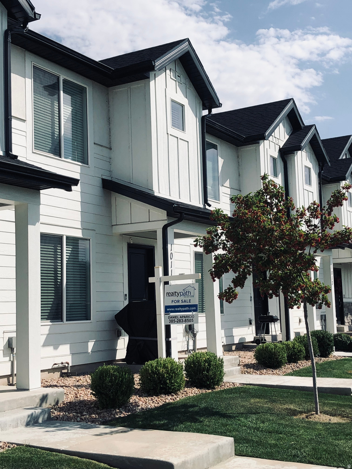 This beautiful mid-unit townhome features front access facing an open green area and a basketball court. This low-maintenance townhome is ideal for a busy family. Located in a quiet neighborhood and built in 2024, this unit offers three bedrooms, two bathrooms, and a full-size, two-car garage. It is strategically situated off Exit 263 on I-15, just minutes from the Provo Airport, the Epic Sports Park, biking trails, and Utah Lake State Park. The driving distance to BYU is about 10 minutes and to UVU about 12 minutes, with Noorda College and RM University also within minutes. Bright interiors with plenty natural light, open primary suite with its own bathroom and walk-in closet, two more bedrooms that share a full bathroom. Also features a laundry room, extra storage space in the 5 ft deep crawling space that also contains a Radon mitigation system. The unit is equipped with a video doorbell, smart thermostat, and smart garage opener, this home provides the new owner with the opportunity of using the comfort of intelligent living. Bring your family outside and enjoy pickleball courts, walking trails, a playground, and the ultimate convenience of nearby shopping and great restaurants. Square footage figures are provided as a courtesy estimate only and were obtained from county records. The buyer is advised to obtain an independent measurement.