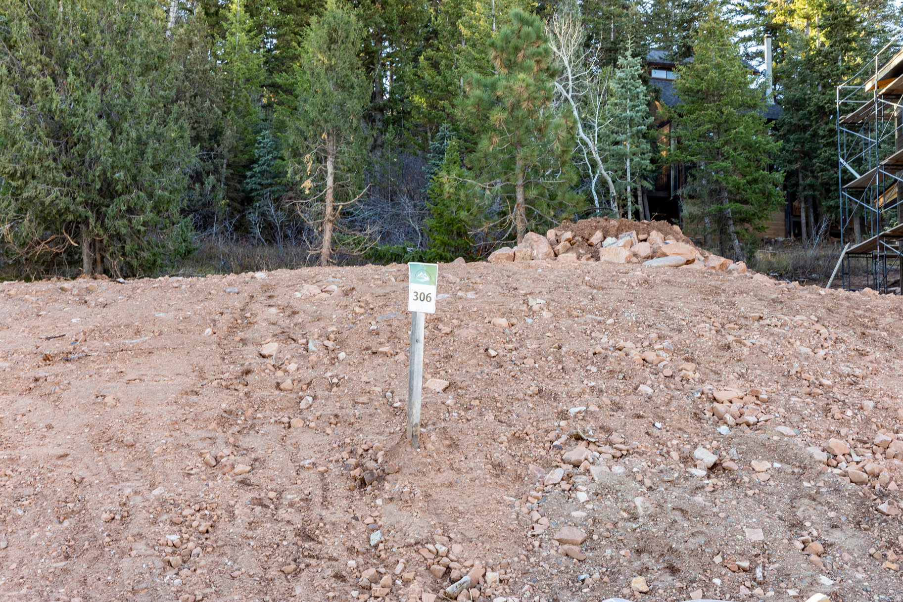 Lot 306 offers a rare chance to own and build in one of Park City's most scenic settings-Toll Creek Canyon. Nestled at the end of a quiet cul-de-sac, this homesite combines privacy, mountain views, and direct access to miles of protected open space. The gently sloped terrain provides flexibility for a variety of floor plans, whether you design a modern mountain retreat or partner with a local builder to create your own semi-custom home. Utilities are stubbed and ready, simplifying the process from concept to construction. Enjoy the peace of canyon living just minutes from Woodward Park City, ski resorts, and Main Street.