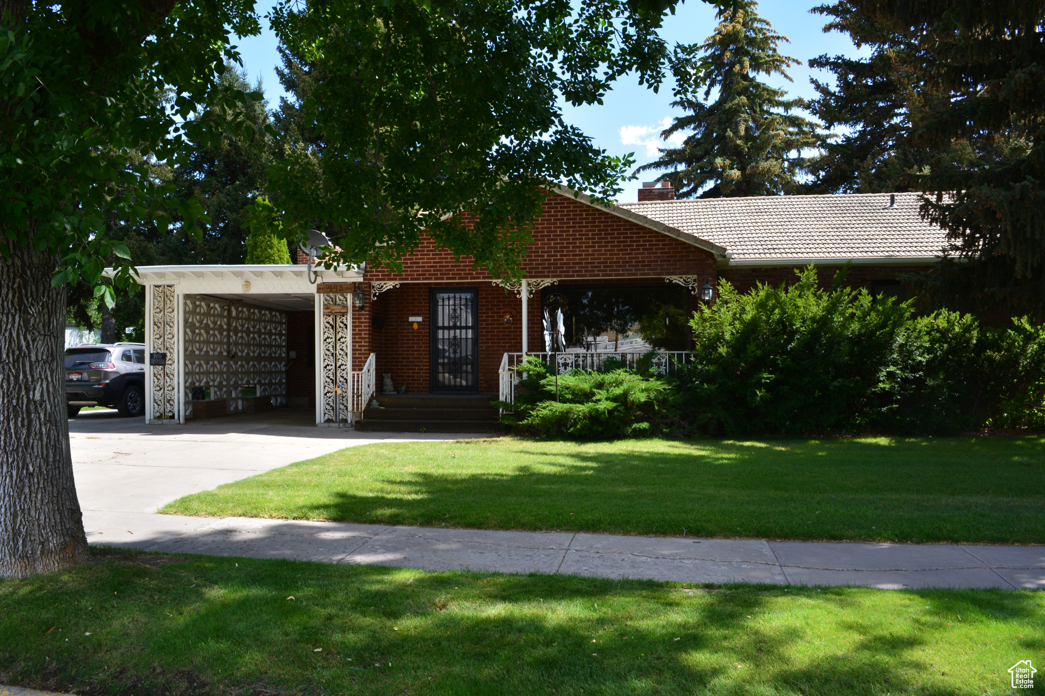SUBSTANCIAL PRICE DROP on this beautiful property. Priced to sell,  this 2848 sqft brick home is sitting on 2 city lots. A must-see. Visit with your guests in the spacious formal living room with big picture windows that allow lots of natural light. Escape to the sunken family room to curl up in your favorite chair and watch TV or just relax in front of the fireplace and read that book you've been setting aside. When you're ready to release some energy head downstairs. Plenty of room for games in the family room that is the full length of the house and has a dry bar on one end.  .39 acres of beautiful landscaped yard. Stay cool and drink your favorite beverage on your covered front deck, shaded from morning and evening sun. Stroll among the shade of the majestic mature pines and trees. A  row of bushes provide additonal privacy along the back fence. Display the flag surrounded by a wonderfully large flower box. Secluded in a corner of the back yard is an enclosed gazebo, perfect for your hot tub. Also there is a covered patio and a covered recreation area for family gatherings. Or just disappear to your spacious workshop and start those projects you've never had room to take on. A garden shed houses all the stuff you need but don't want just laying around. Make your appointment to see this gem.