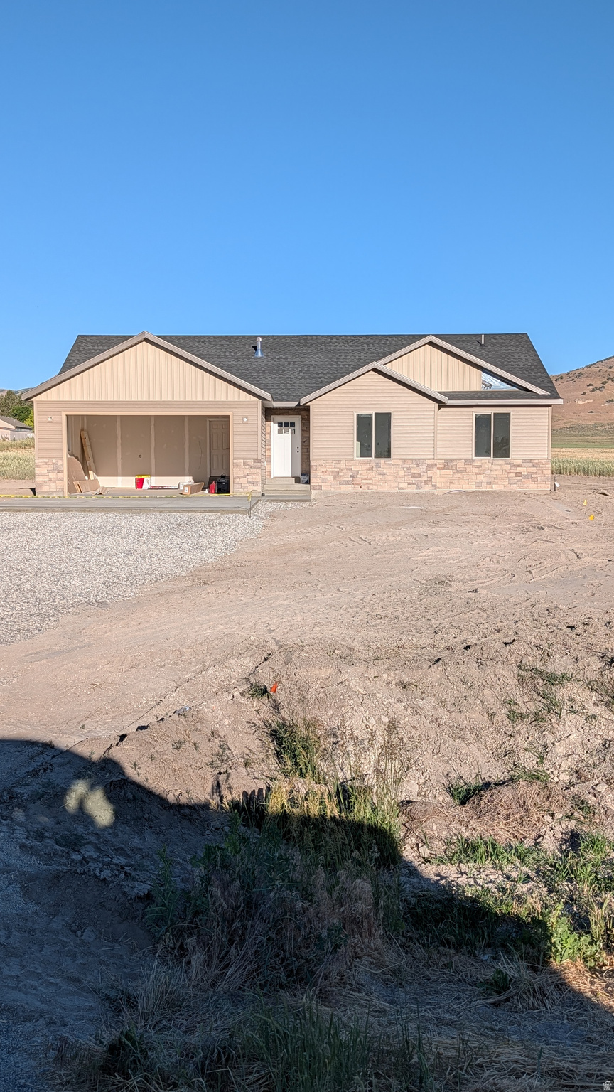 Great new construction located on a Large 2.0 acre lot in the quiet setting of Portage Utah. SELLER WILOL PAY $10,000 TOWARDS BUYERS CLOSING COST AND INTEREST RATE BUY DOWN!!! Bring your Horses or other animals!! 3 bedroom, 2 full bathroom home with vaulted ceilings. Custom cabinetry throughout with stainless steel appliances that include a French door refrigerator with ice and water, gas range, dishwasher and microwave oven. 2 Car attached garage that is insulated with an insulated garage door and operator. Make this home yours today!! 20 Minutes from Tremonton and 15 Minutes from Malad. Leave the BIG City behind for this rural quiet setting. Property taxes TBD Square footage figures are provided as a courtesy estimate only. Buyer is advised to obtain an independent measurement. Taxes have not been assessed with the new home on the property.
