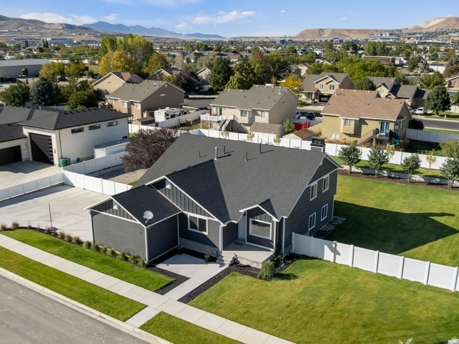 Professionally remodeled home in an exceptional location, surrounded by multimillion-dollar homes, situated on a rare flat .50 acre lot with no HOA, offering endless possibilities to park all your RV's and toys, build a detached garage, shop, or even an ADU, all in addition to the 3-car garage! Nearly every inch of the home has been updated, including a new roof, windows, garage doors, flooring, lighting, landscaping, appliances, and epoxy garage floors, plus an HVAC system only 8 years old. The spacious primary suite features a walk-in closet and a beautifully remodeled ensuite bath with a brand-new shower. The lower level offers an additional large flex space ideal for a home gym, workshop, or additional storage. Move-in ready and shows like a model. Quiet location with convenient access to I-15, shopping, parks, schools, and two Costco locations within 3 miles. Easy to show
