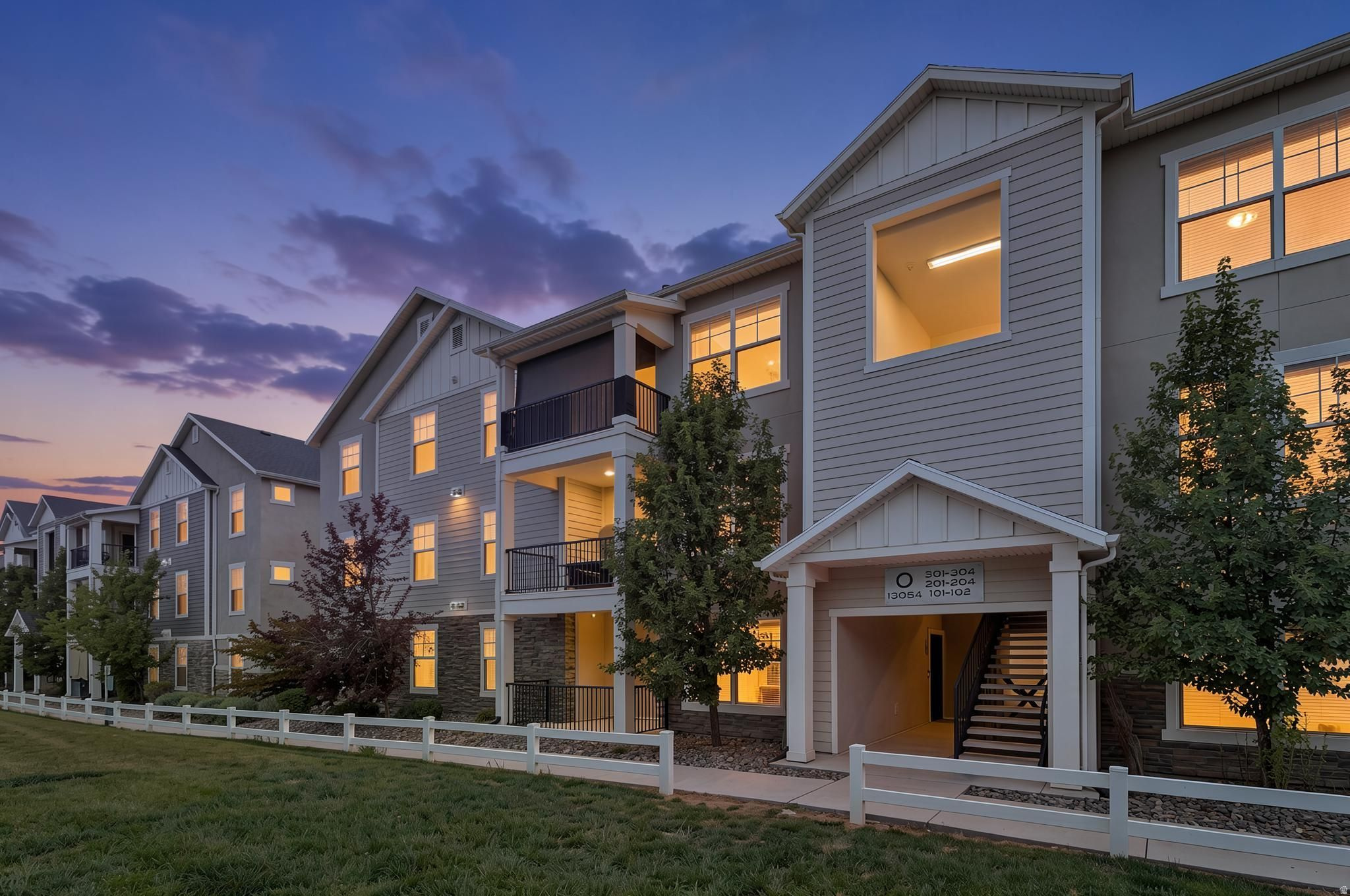 Beautiful 3-bedroom, 2-bathroom ground-level condo in the heart of Herriman featuring an attached garage with direct home access-one of the few units in the community with this sought-after feature. The open-concept floor plan offers vaulted ceilings, abundant natural light, and stylish finishes throughout, creating a bright and inviting living space. The spacious primary suite and well-designed layout provide comfortable everyday living. Enjoy resort-style community amenities, including a swimming pool, clubhouse, sports courts, walking trails, and a playground. Conveniently located near shopping, dining, schools, parks, and Mountain View Corridor, this move-in-ready Herriman condo offers the perfect combination of comfort, convenience, and low-maintenance living. ALL FURNITURE INCLUDED IF WANTED