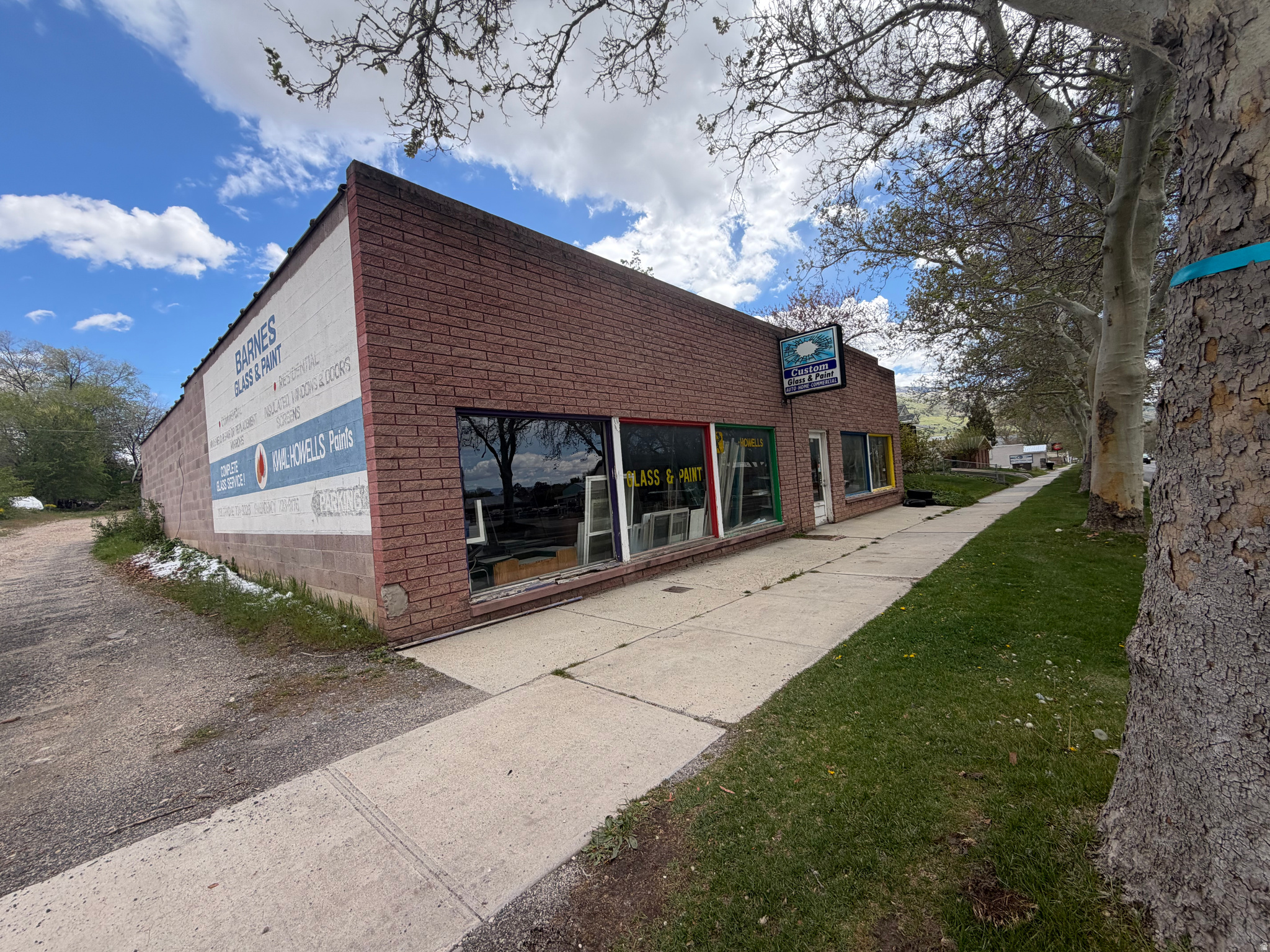Building with large retail space, and work shop areas.