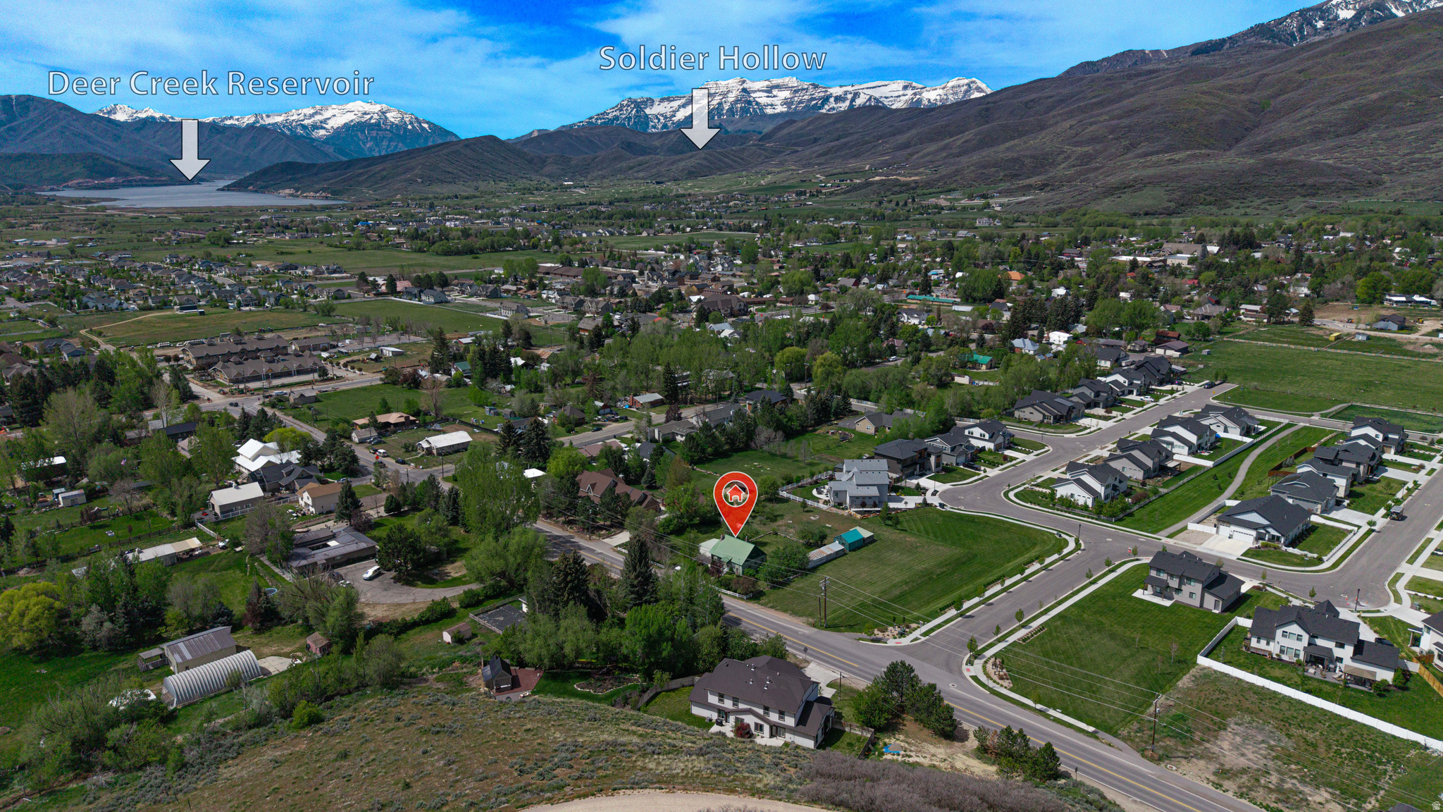 Rare nearly one-acre parcel in Midway's R-1-9 zone with approximately 217 feet of River Road frontage. For the right buyer, this property offers exciting future potential as a spacious homesite, investment property, or possible development opportunity. Zoning may allow for multiple subdivision options and dwelling-unit configurations, subject to city approval. Historically, there were two detached homes on the property. The home to the north has since been demolished, but Seller reports the separate water and sewer utilities for that home remain stubbed and active with Midway City, with ongoing fees currently being paid. The existing home is also connected to utilities. Buyer is advised to verify all zoning, lot dimensions, frontage, subdivision potential, density, utility status, impact fees, and development approvals with the City. Interior photos have been edited for presentation purposes to help buyers envision the home's potential. Sellers are in the final stages of cleaning out the property.