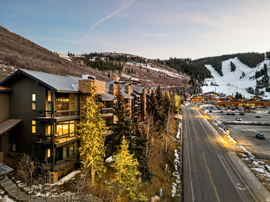 Prime Deer Valley Condo with Views, Updates, and Exceptional Rental Appeal  Located just steps from Deer Valley's Snow Park Lodge, this beautifully updated corner residence offers one of the most sought-after positions in Lower Deer Valley. The 1,500 square foot layout features two spacious bedroom suites thoughtfully placed on opposite sides of the condo for privacy, along with a convenient half bath for guests.  The main living space is light-filled and welcoming, with an open kitchen that connects seamlessly to the dining area and great room. Updated cabinetry, appliances, lighting, and flooring give the home a refreshed, contemporary feel, while the remodeled fireplace creates a natural gathering point after a day on the mountain.  Two private outdoor decks extend the living space, including one with a large hot tub that invites you to unwind while taking in mountain views and alpine air. Generous storage throughout adds to the home's functionality, making it equally well suited for full-time living, a second home, or a high-performing nightly rental.  Set directly on the free Park City bus route, this location provides effortless access to Main Street dining, shopping, and year-round recreation, all while being moments from Deer Valley skiing. A rare opportunity to own a turnkey condo in one of Park City's most desirable resort locations.