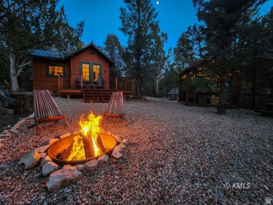 Rare development play 20 minutes from Zion's East entrance and just up the road from the new East Zion Visitor Center under construction. Three contiguous lots (1.08, 1.48, 1.04 acres) among Ponderosa pines on Zion's fast-appreciating east side.  All three lots are connected to the new water system - a $180,000 value already in place. The middle lot features a turnkey cabin operating as an established vacation rental, with power, septic, gazebo kitchen, grill, fire pit, bath house, and 500-gallon propane tank. Income from day one while you build out the flanking lots, which have water at the lot line and are ready for new construction.  Scaling to three units on a single contiguous parcel is a real advantage where most listings are single lots. The new visitor center is expected to shift significant traffic to this side, and east-side inventory is limited. Walk to Zion trailheads; easy reach to Bryce Canyon, Lake Powell, and the Grand Canyon's North Rim.  Family retreat, rental portfolio, or appreciation play - rare optionality on Zion's east side. Buyer to verify all.