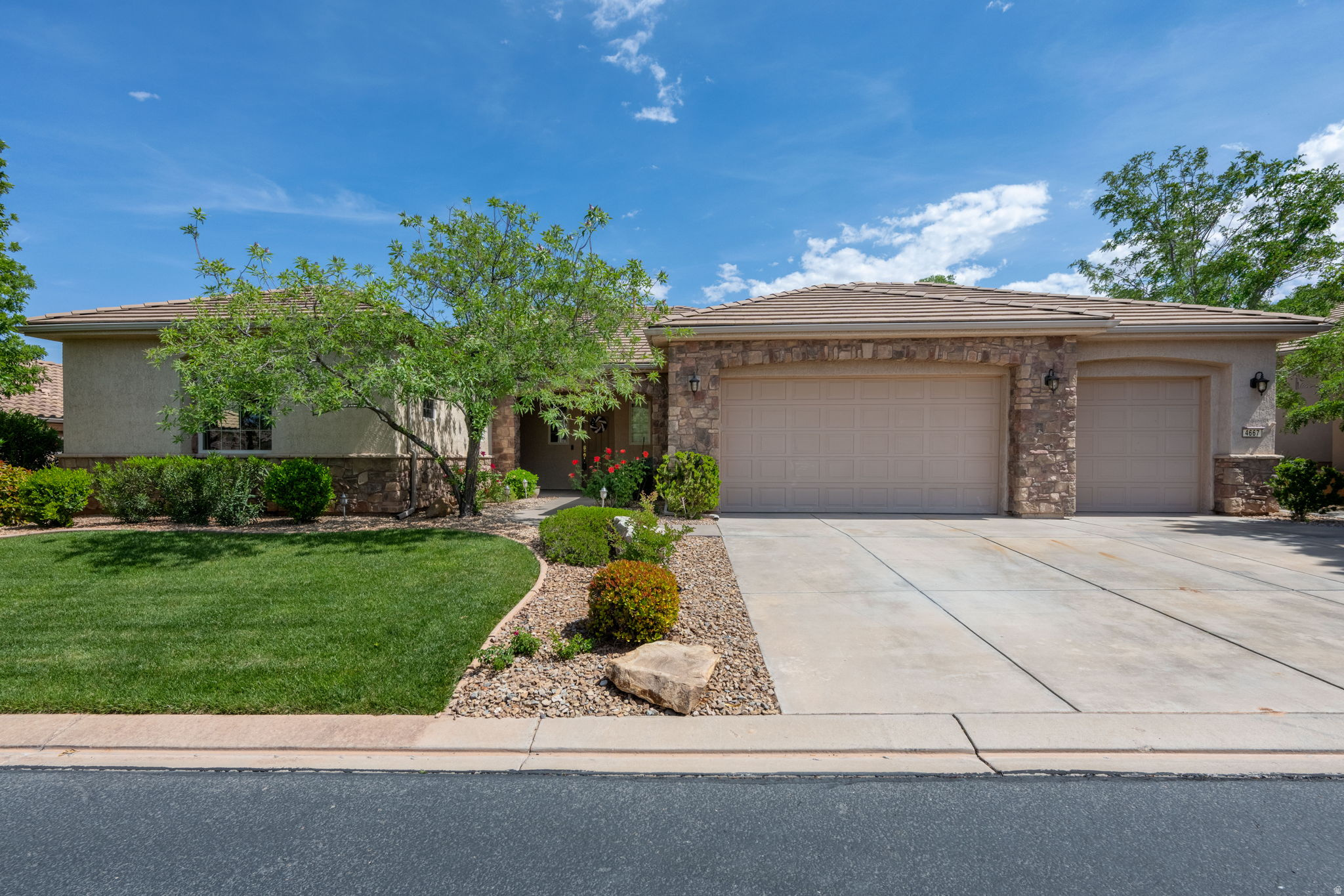 If you are looking to enjoy all that sunny St. George has to offer in a 55+ neighborhood, it doesn't get much better than this home in Sun River. This home offers a floor plan that works great for guests and easy living with two primary bedrooms and open living spaces. A three car garage with its own separate HVAC unit for your golf cart or work shop makes this home even more enticing. Sun River offers amenities for a fun and enjoyable retirement or second home with pools, pickleball courts, activities, and more trails than you can think of! To sweeten the deal, a golf cart is available with the home purchase as well. Don't miss out on this unique, well-maintained home! Schedule a showing with the listing agents today!