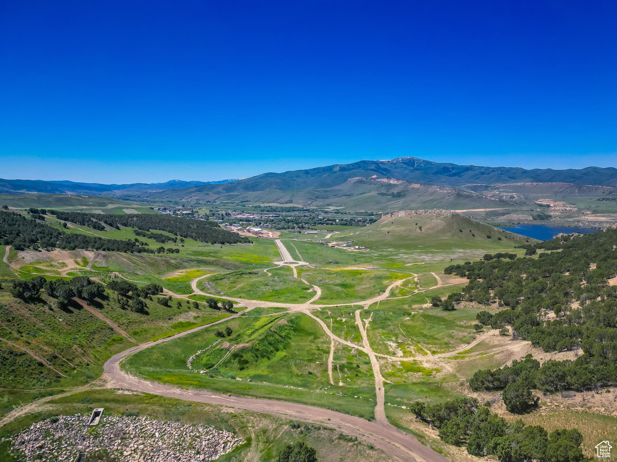 After a 20-year ownership by one Utah family, Chalk Creek Crossing is officially on the market. Summit County zone changes have reduced residential building envelopes in nearby areas from 40 to as little as 2.5 acres, creating the opportunity to develop spectacular residential projects close to the Park City Basin with its depleting residential opportunities. Summit County officials prefer this location for the residential and commercial projects that will eventually develop along Chalk Creek Road. New home owners will wake up to crisp mountain air, clear blue skies, and views of Coalville City, Chalk Creek, and the Weber River. The property is nestled between Coalville City to the south, Echo Reservoir to the west, and Echo Junction (I-80/I-84) to the north. Chalk Creek Crossing consists of approximately 125 acres, mostly agricultural with commercial potential. Both Coalville City and Summit County officials understand the potential of this property and are willing to discuss its future. Three reservoirs (Jordanelle, Rockport, and Echo), Park City, the Uinta Mountains, golfing, running, fishing, hunting, and several ski resorts are located nearby. Buyer can develop their own master plan for Chalk Creek Crossing incorporating a combination of single family lots, single family homes and condominiums, multi family housing, ranchettes, retail, office, and industrial buildings. Coalville City has been anticipating a large residential/commercial development at this location for several years. Industrial zoning is in place with an approved mix use overlay. A large residential/commercial project is being planned with Summit County south of Coalville in the Hoytsville area. Property consists of Summit County Tax ID #'s CT-301-C-1, CT-250, NS-329-B, CDRHTS-1 through 24. All information herein is deemed reliable but is not guaranteed. Buyer is responsible to verify all listing information, including square feet/acreage, to buyer's own satisfaction.