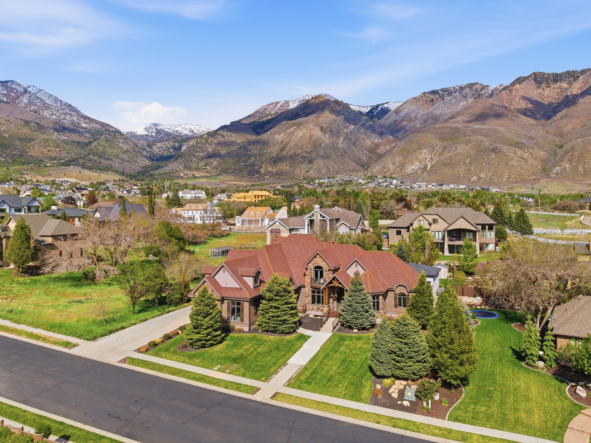 Beautiful home nestled in the picturesque mountains of Alpine, Utah - completely transformed with a full first-floor remodel that touches every surface and system. Stunning new Sheoga white oak Amish hardwood floors flow throughout the main level, complemented by fresh carpet, updated tile in the mud room, powder bath, and laundry room, freshly painted walls and trim, redesigned kitchen and master bathroom cabinetry with new hardware, whitewashed stone, and designer lighting throughout - every detail considered, nothing left untouched. Situated on a spacious half-acre lot with breathtaking mountain views from every angle, the home also received a complete HVAC overhaul with two new Rheem heat pump and AC units so efficient the furnace rarely even cycles, plus a HEPA filtration system for absolutely clean, healthy air and perfectly refined zoning throughout. Smart living is seamlessly integrated on the main floor with fully updated smart switches compatible with Apple HomeKit, Amazon Alexa, and more. The chef's kitchen is anchored by a brand-new Sub-Zero refrigerator and a new Scotsman pebble ice machine - the finishing touch for effortless entertaining. Step outside and immerse yourself in your own private oasis, complete with a sparkling saltwater pool and relaxing hot tub, ideal for unwinding after a long day of adventure, plus a covered backyard BBQ pavilion perfect for grilling while enjoying the crisp mountain air. The main floor master bedroom retreat offers stunning views, a spacious en-suite bathroom, and generous closet space - all on one level for ultimate convenience. Need extra space? The fully independent 3-bedroom accessory dwelling unit (ADU) provides ample room and privacy for guests or extended family, and can be rented separately for additional income. The basement also features a home theater and a large, well-equipped gym. Additional home systems include central vac, several wired audio connections, tankless water heaters, a soft-water system, and a radon mitigation system. With easy access to world-class hiking, skiing, and mountain biking - and just minutes from shopping, dining, and entertainment - this is a rare opportunity to own a fully renovated mountain paradise. Schedule your private showing today.